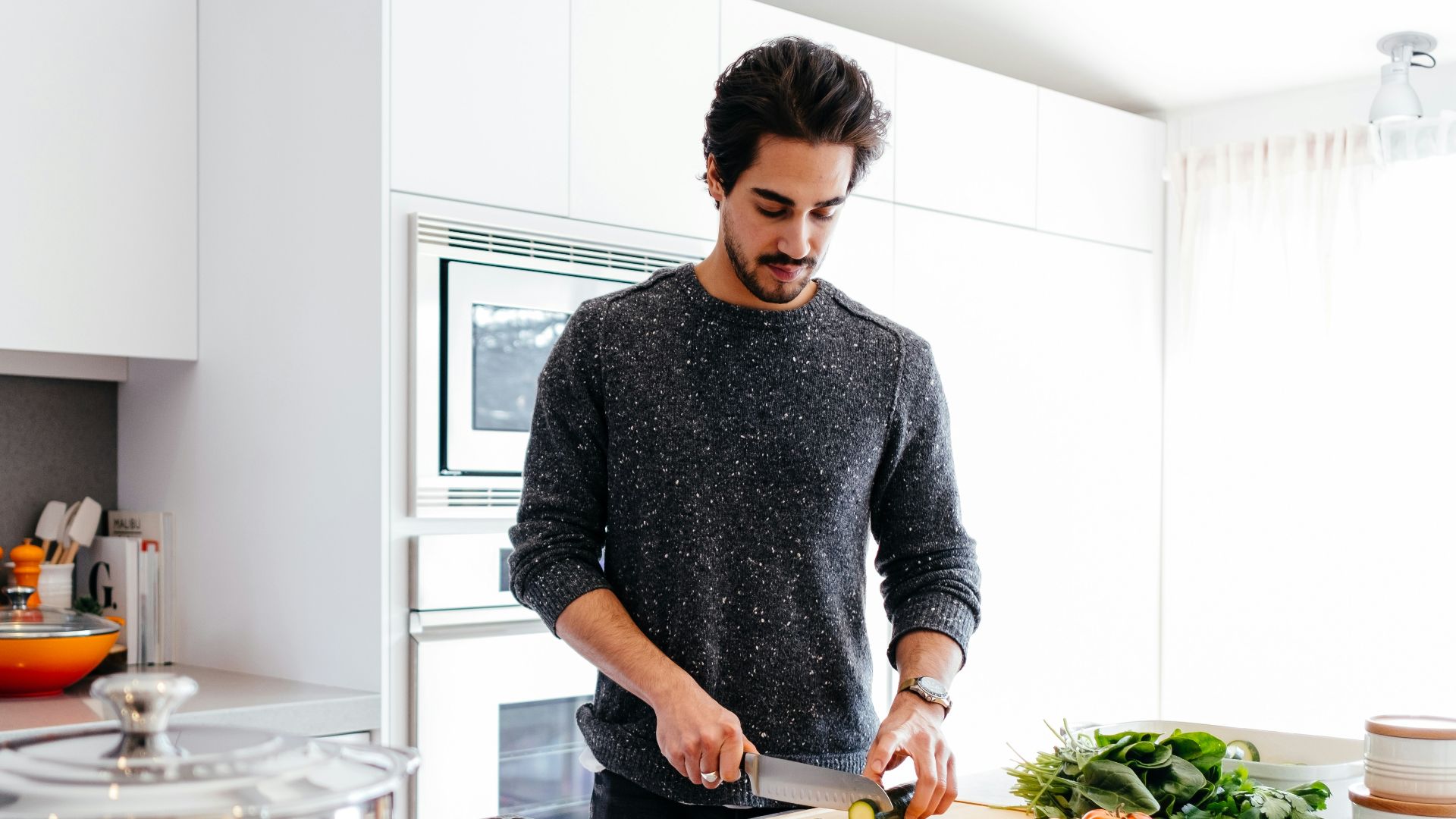 man cutting vegetables