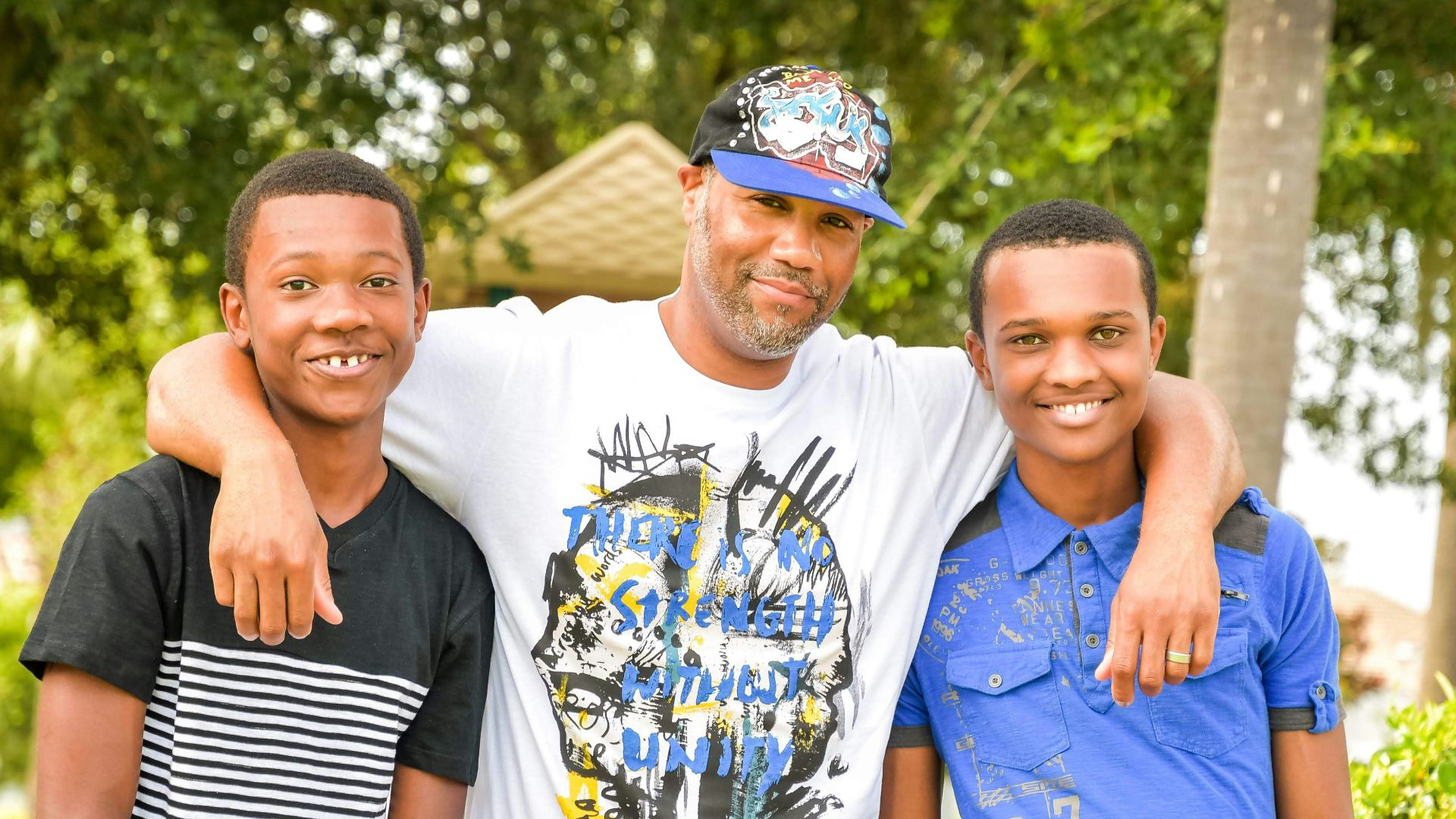 three young men standing next to each other