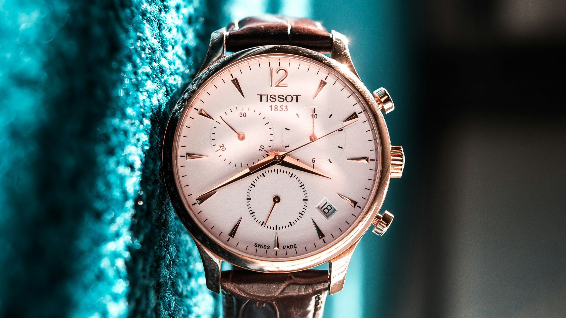 round silver-colored Tissot chronograph watch