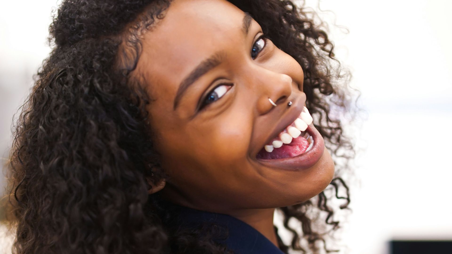 woman looking back while smiling