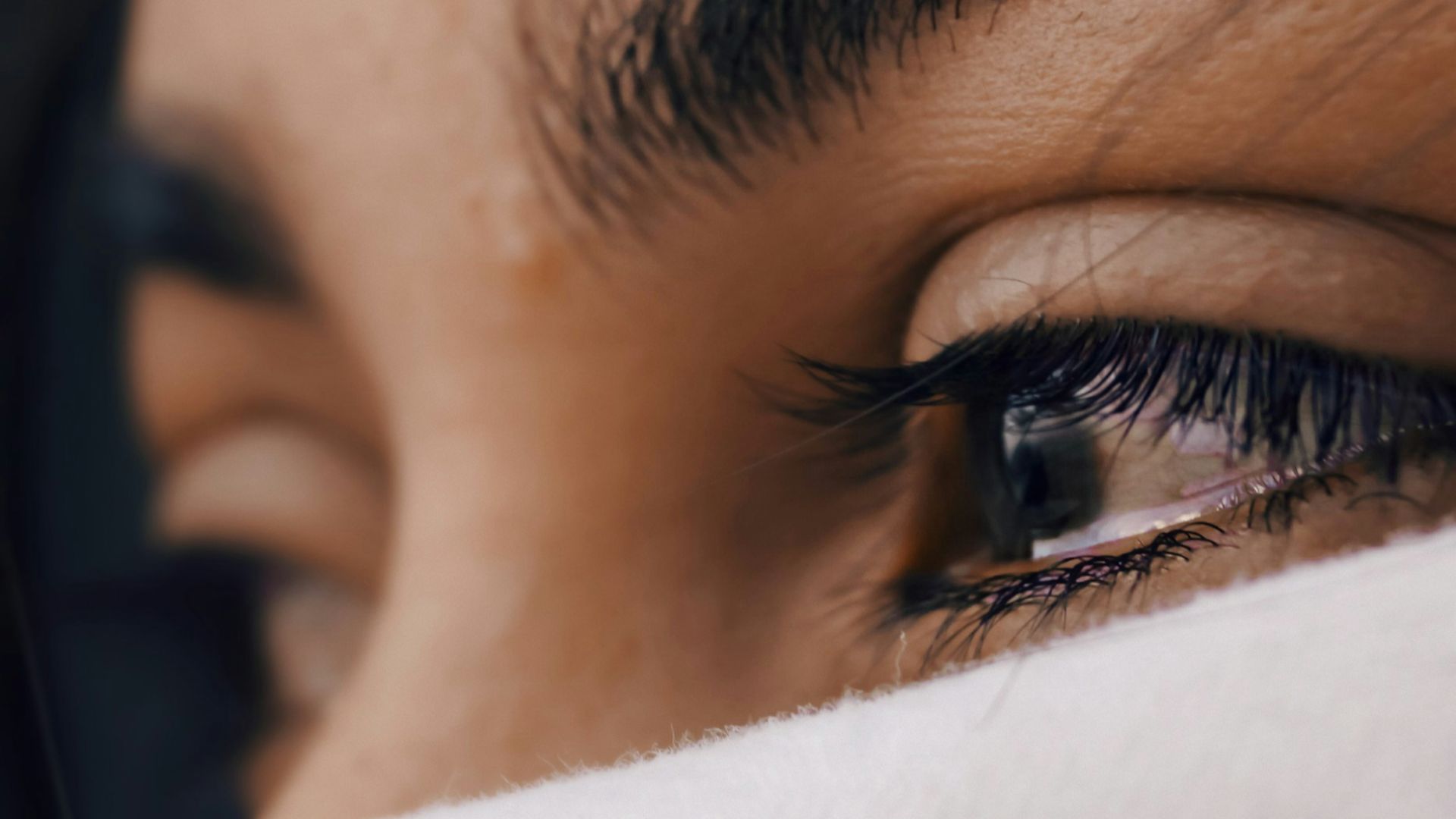 shallow focus of a woman's sad eyes