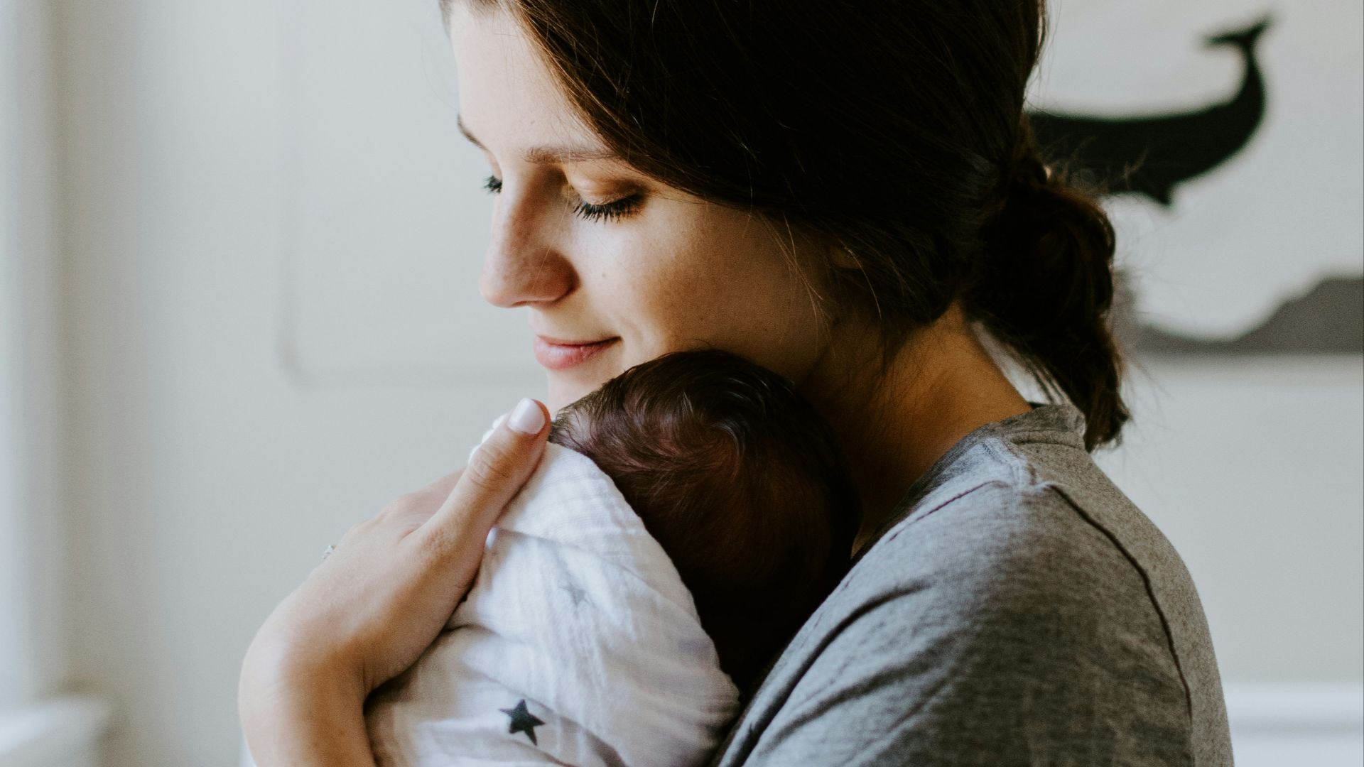 mother carrying baby