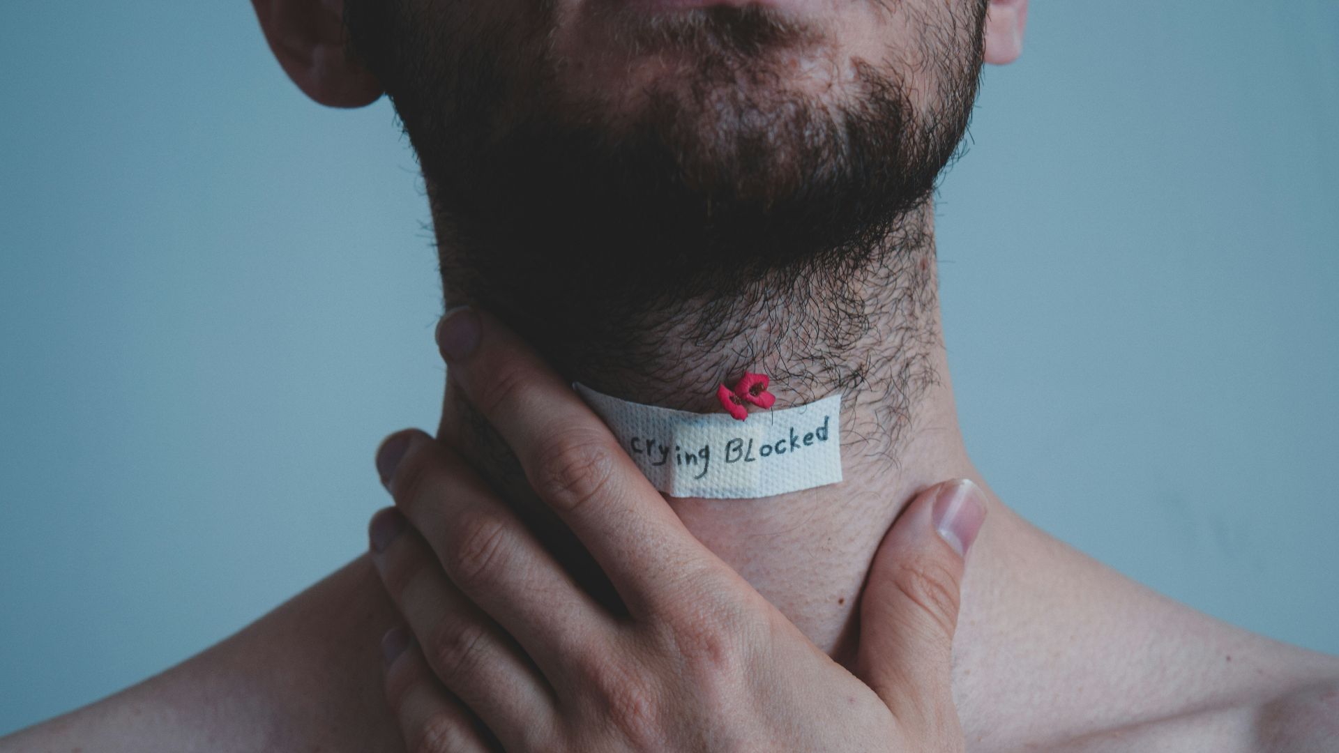 man with tattoo on his right hand