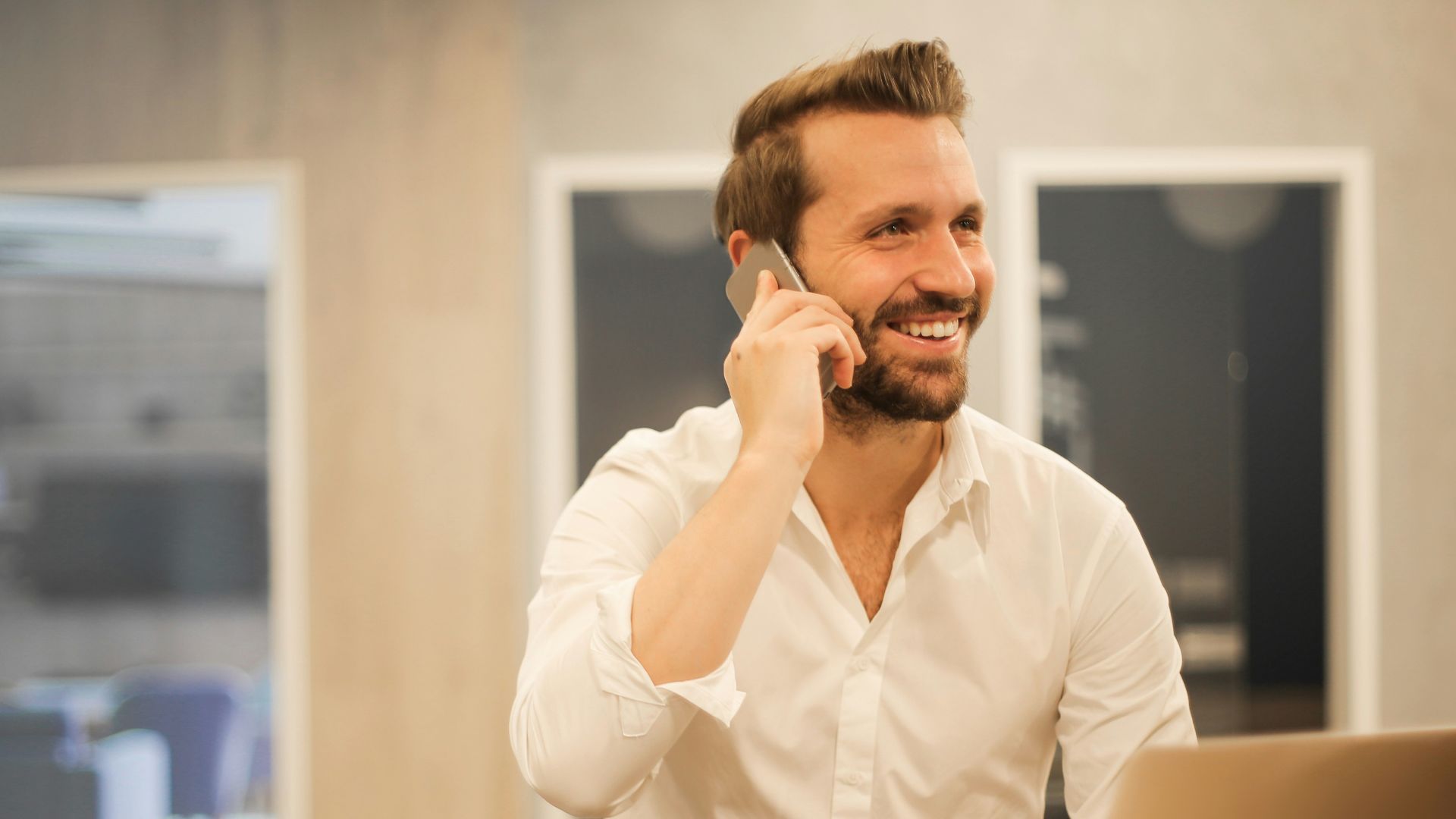 man using smartphone on chair