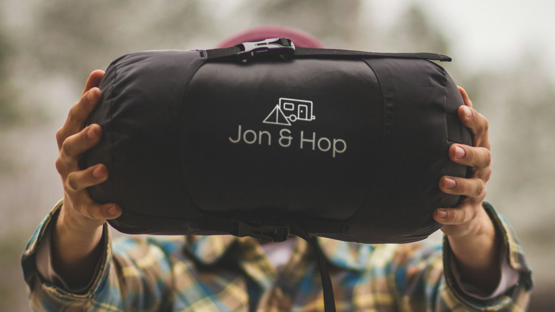 person holding Jon & Hop bag