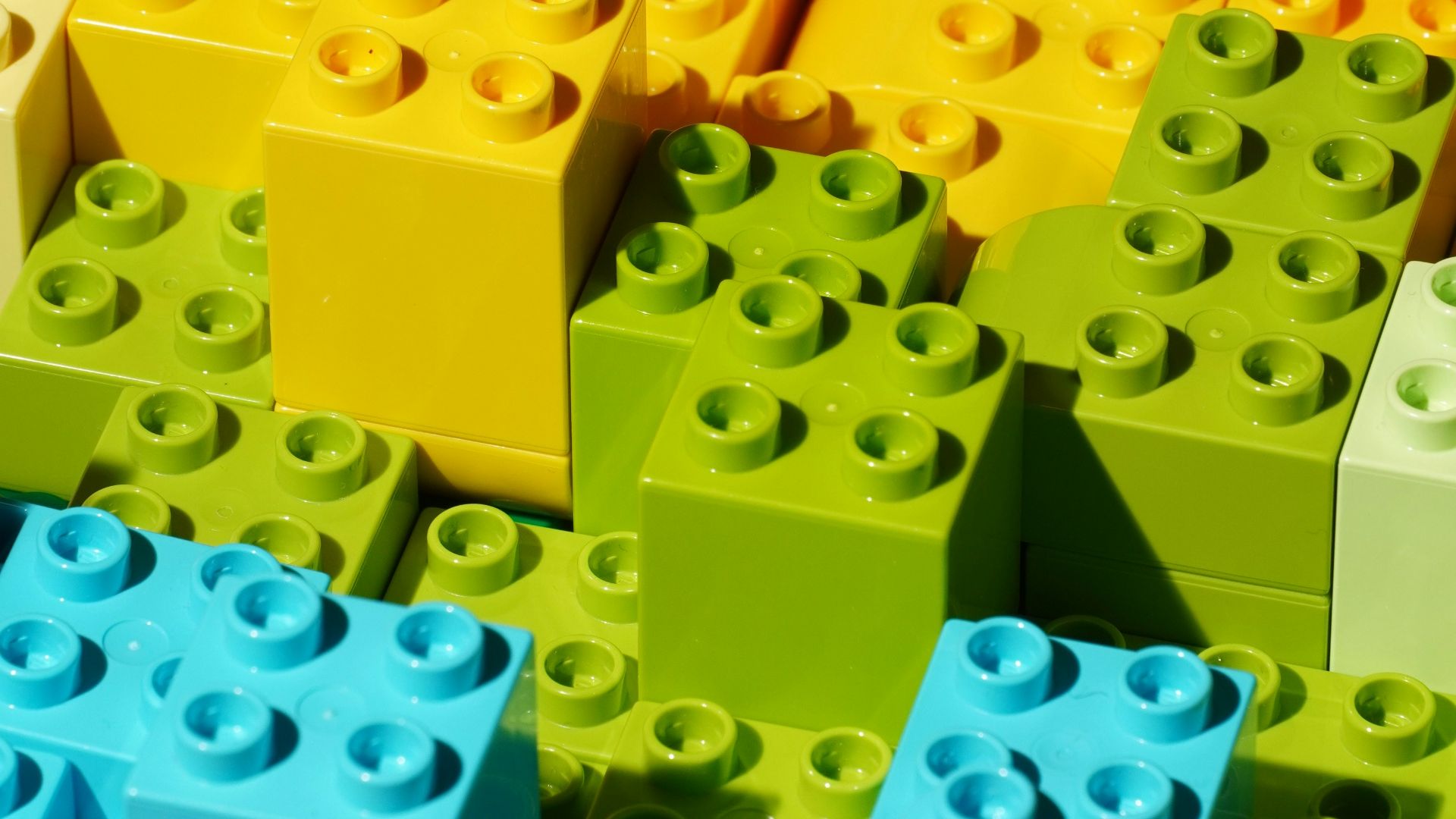 a close up of many different colored legos