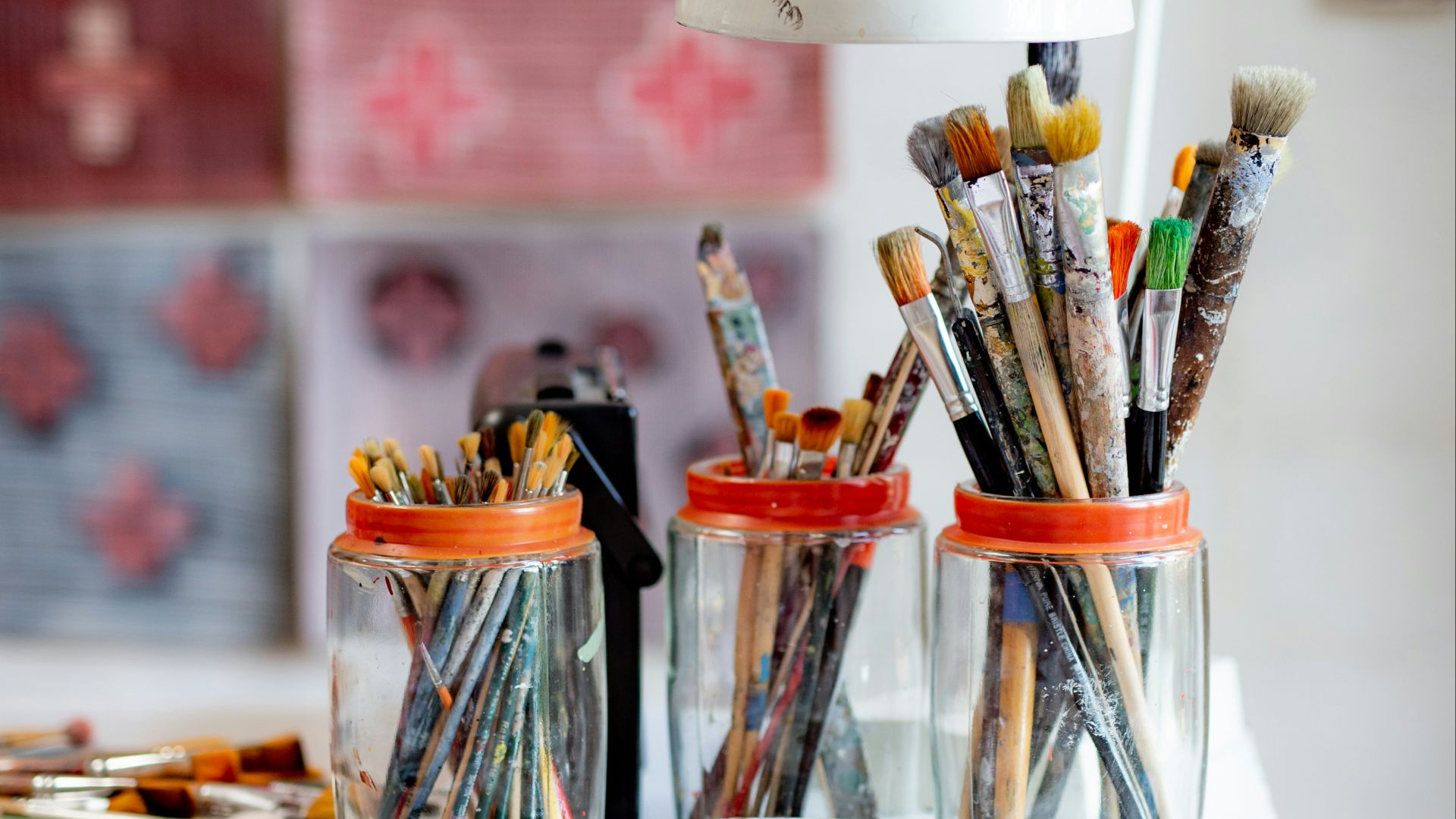 white ceramic plate with paint brushes and paint brushes