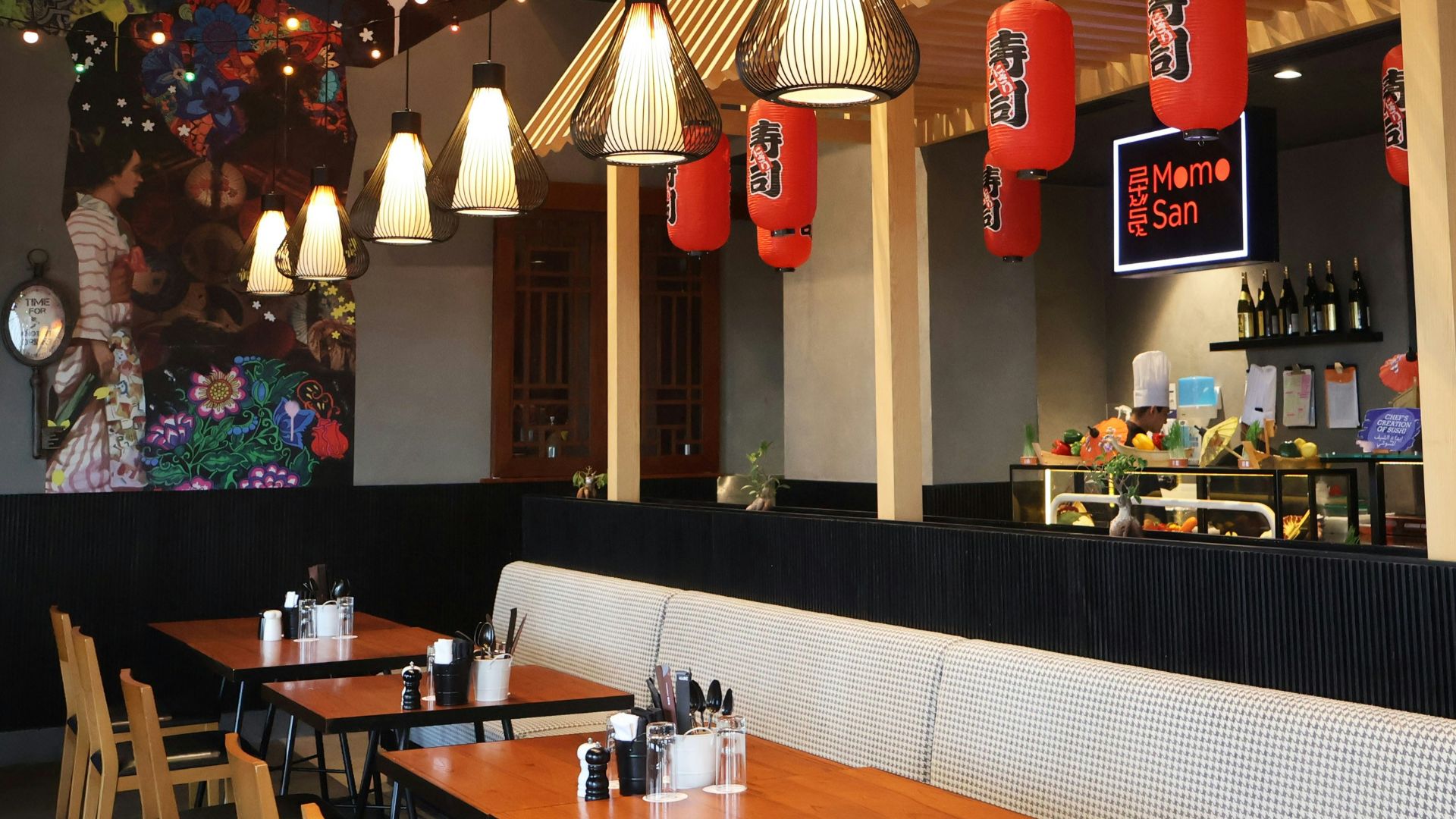 A restaurant with a lot of tables and chairs