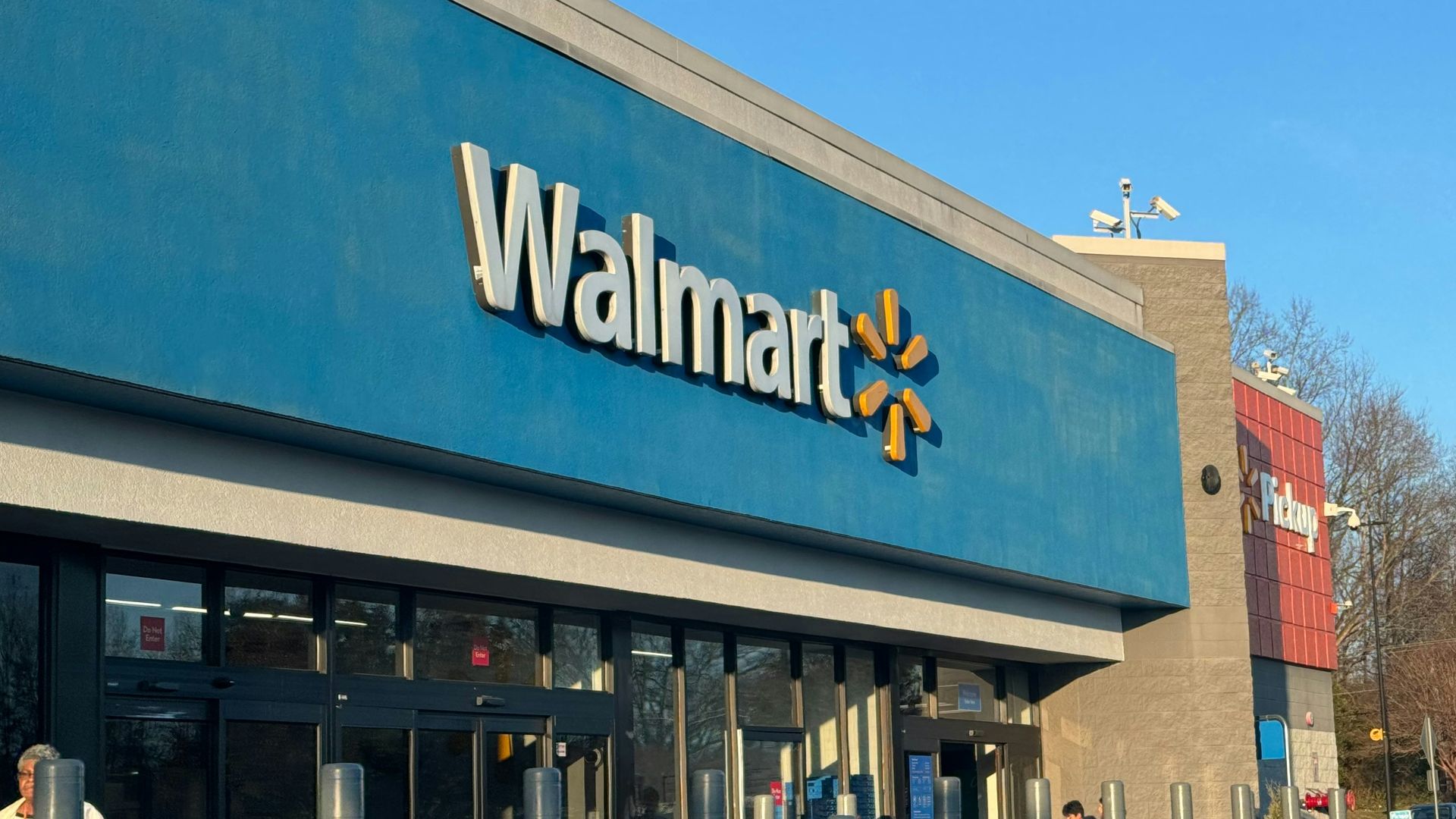 a walmart store with a car parked in front of it