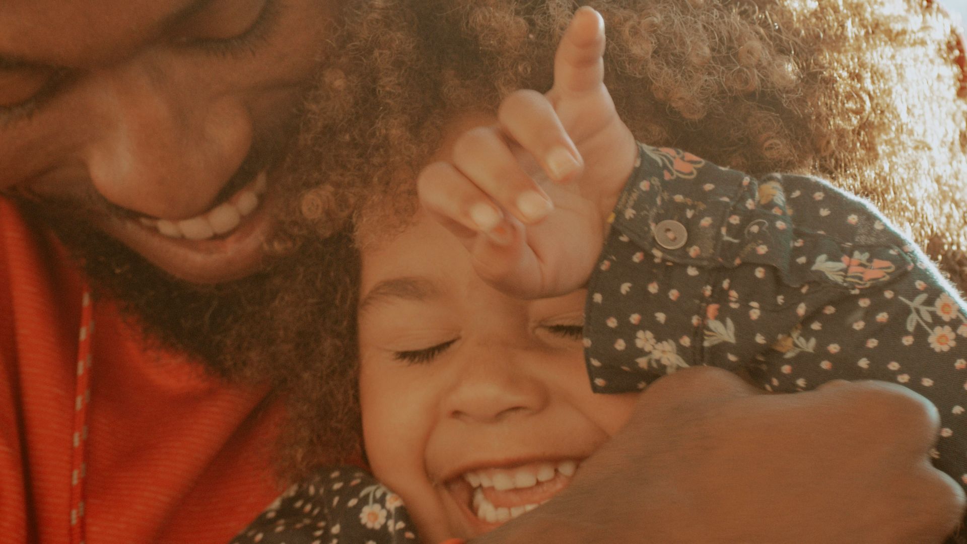 woman in red hoodie holding her hair