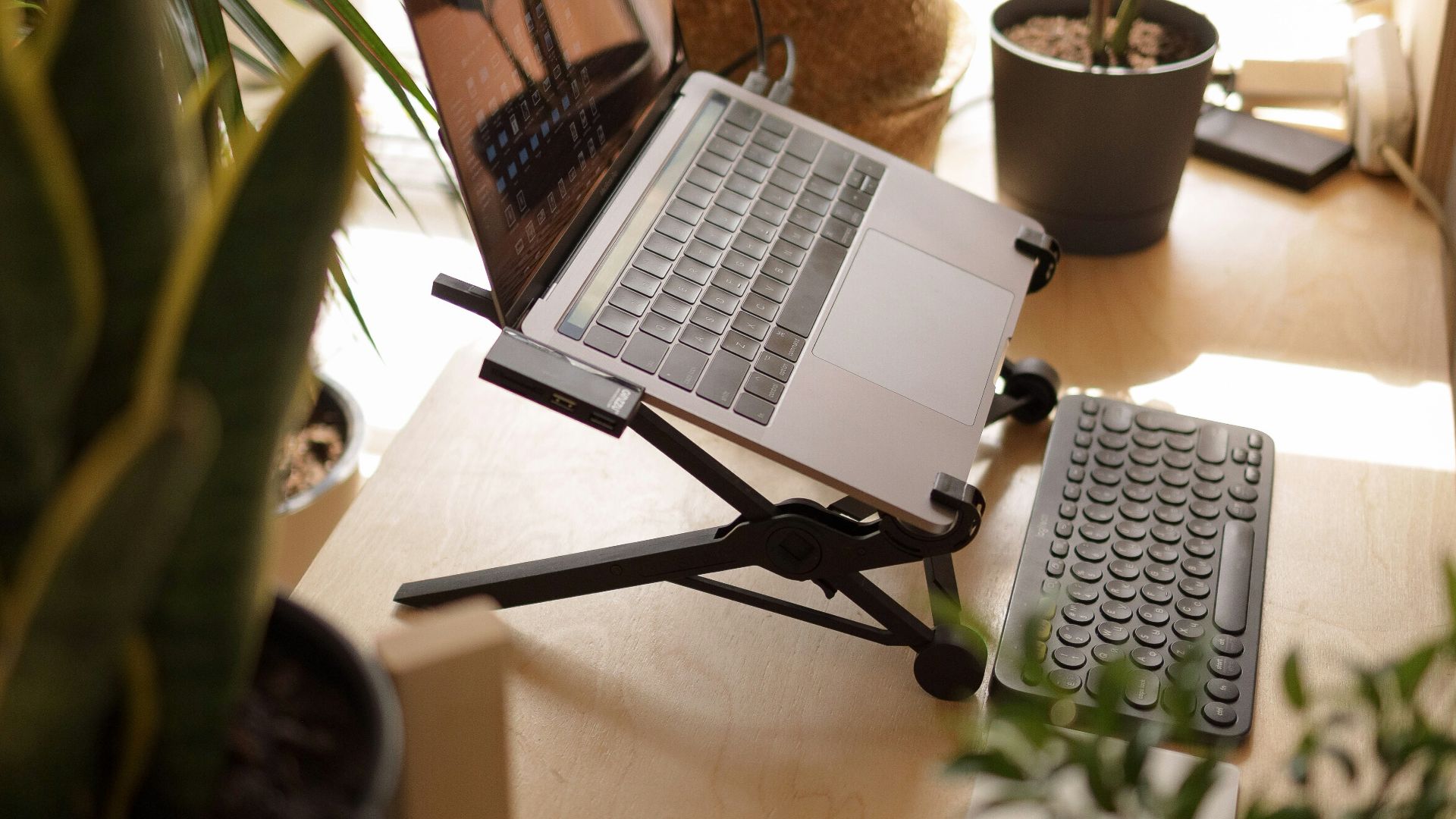 macbook pro on brown wooden table