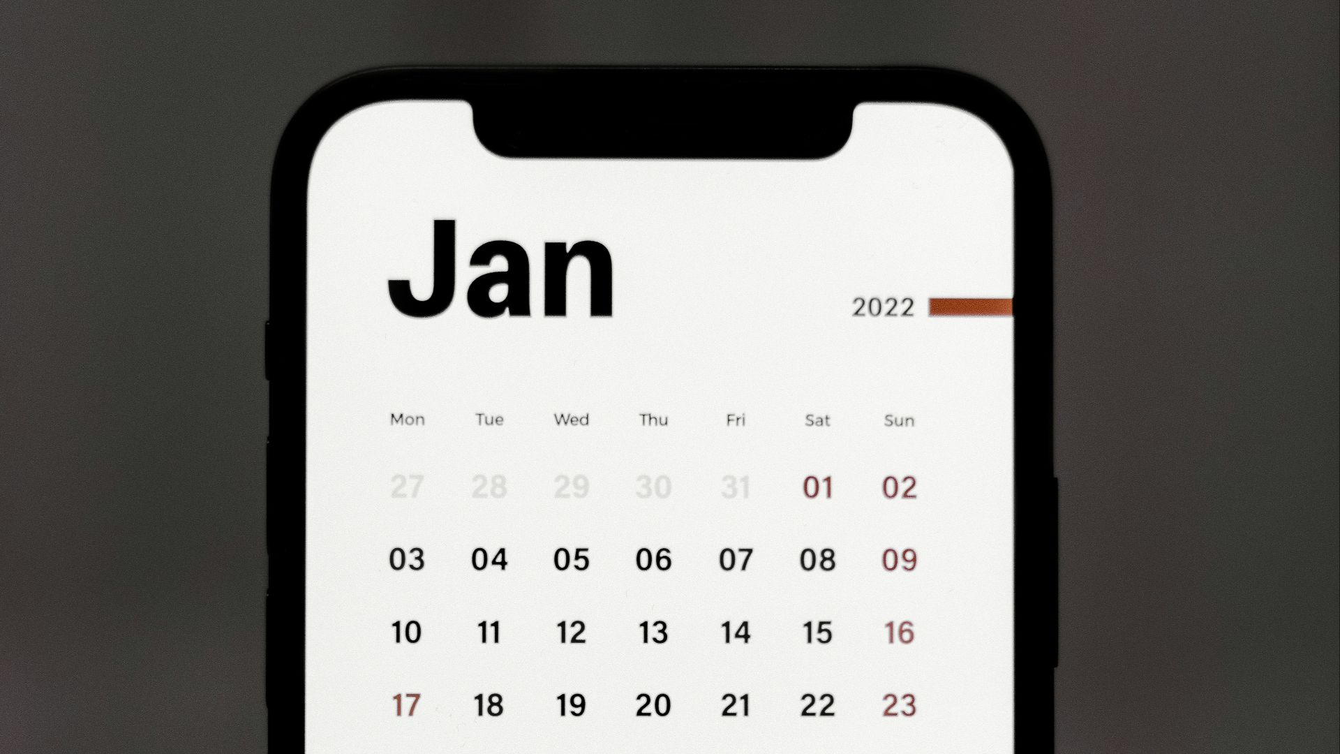 a calendar phone case sitting on top of a table