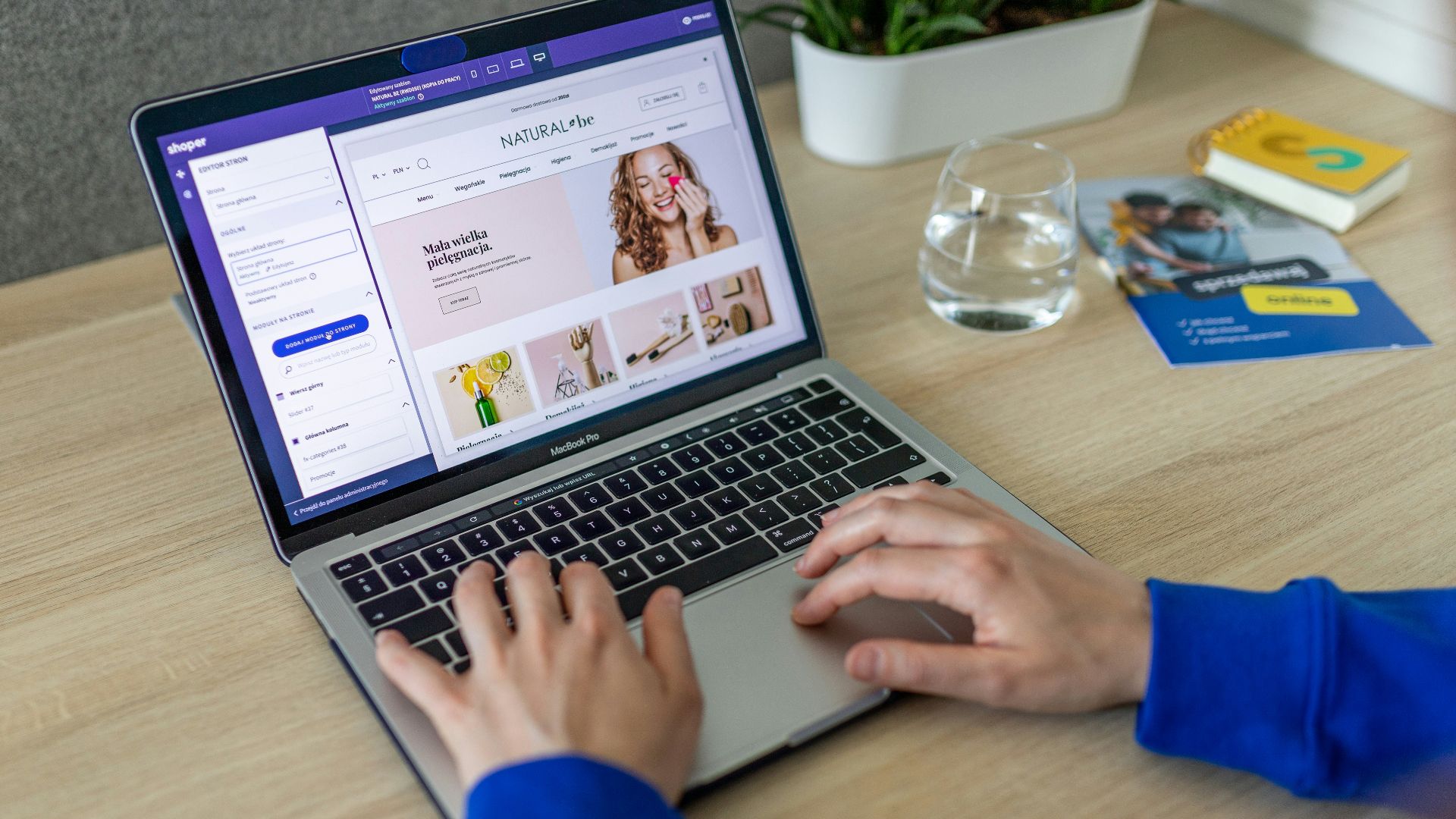 a person typing on a laptop on a table