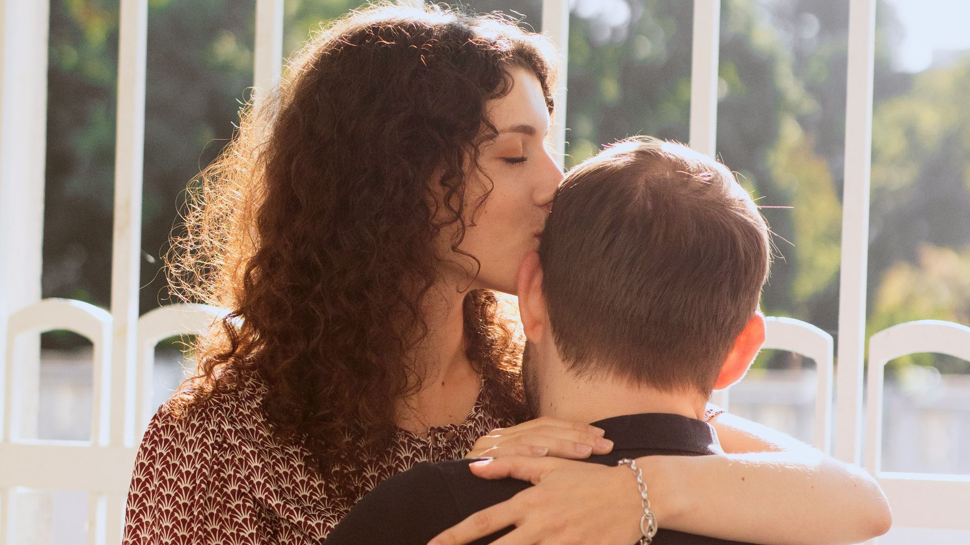 a couple of people that are kissing each other