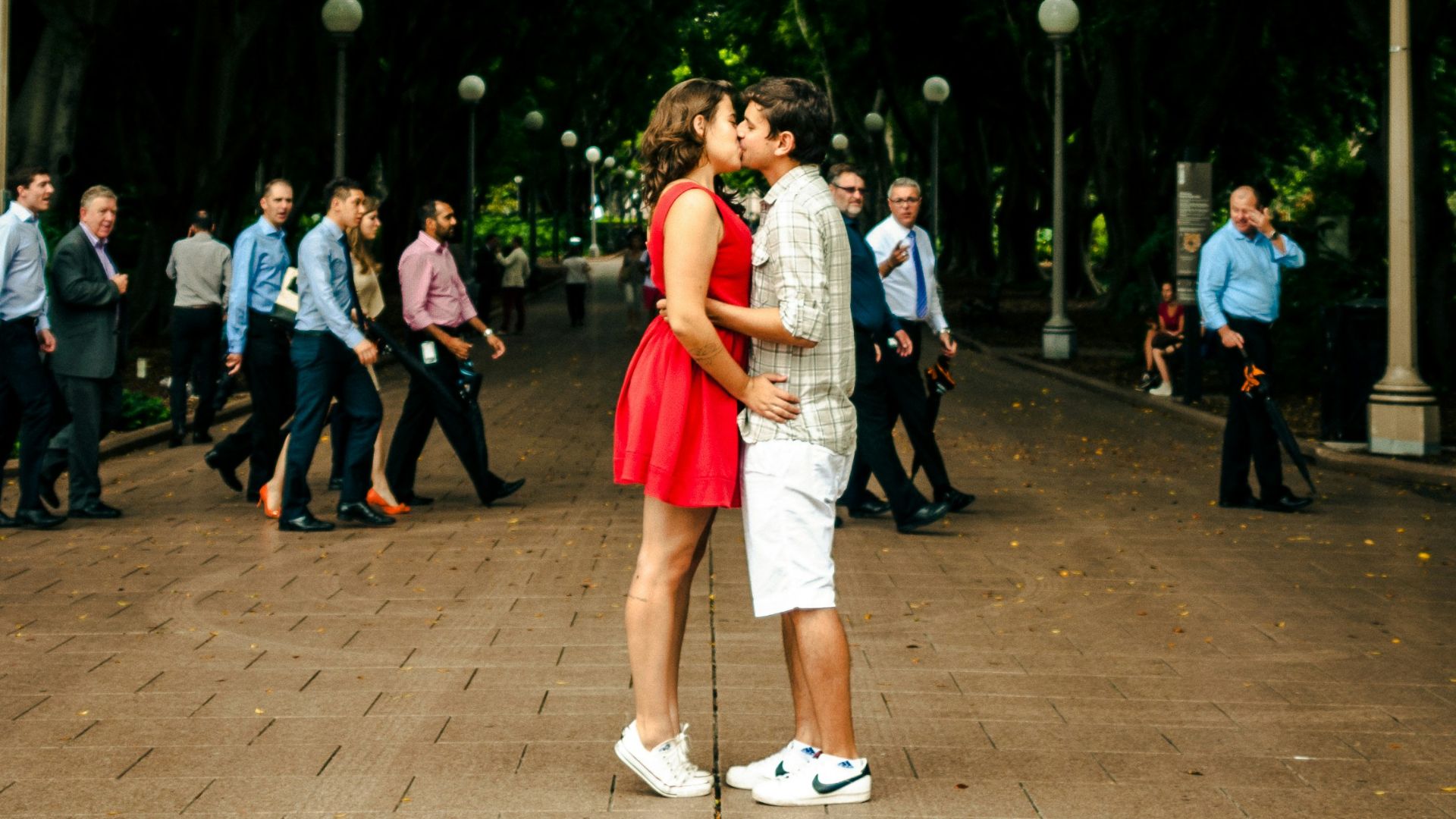 man and woman kissing each other