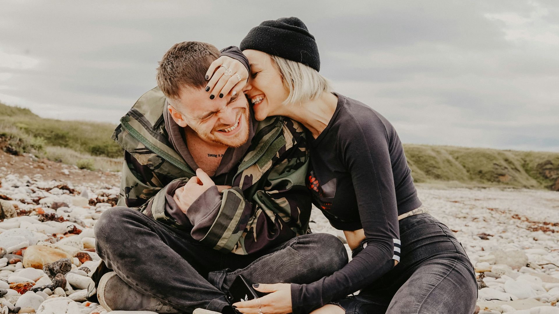 unknown persons sitting outdoors