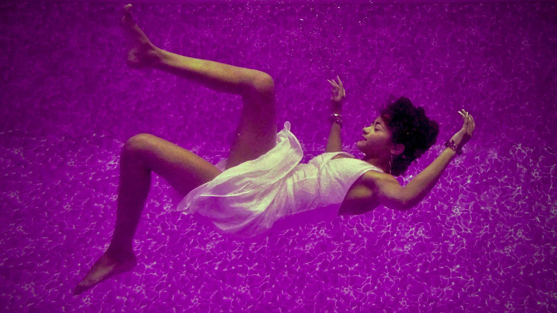 woman falls on purple surface