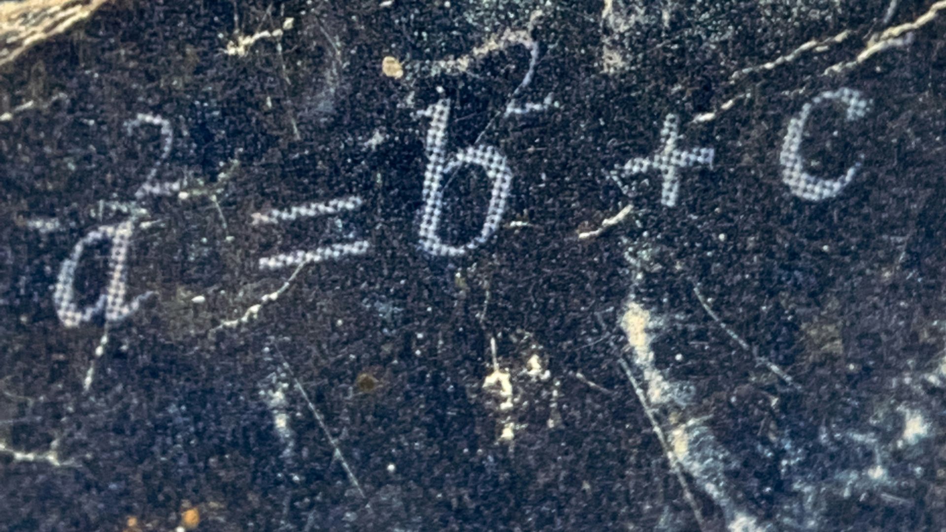 a close up of a marble surface with numbers on it