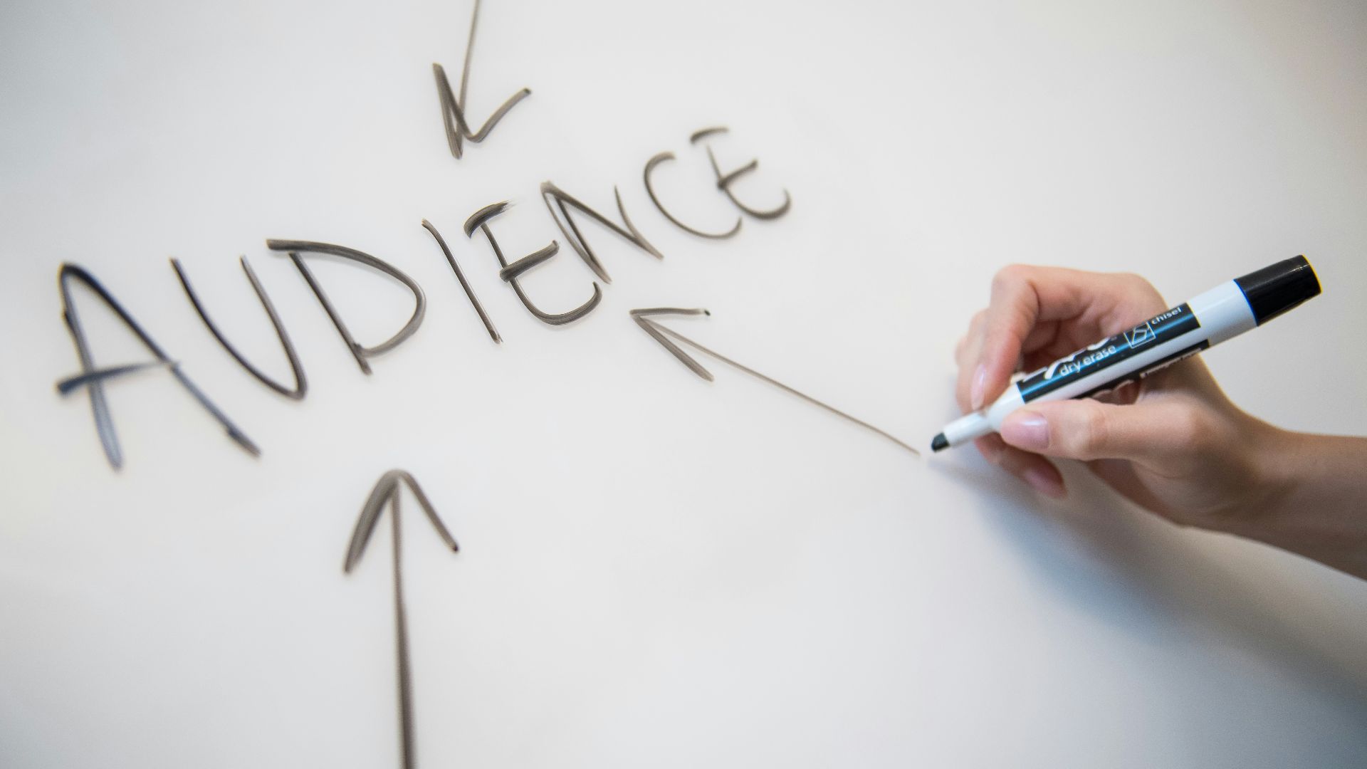 person writing on white paper