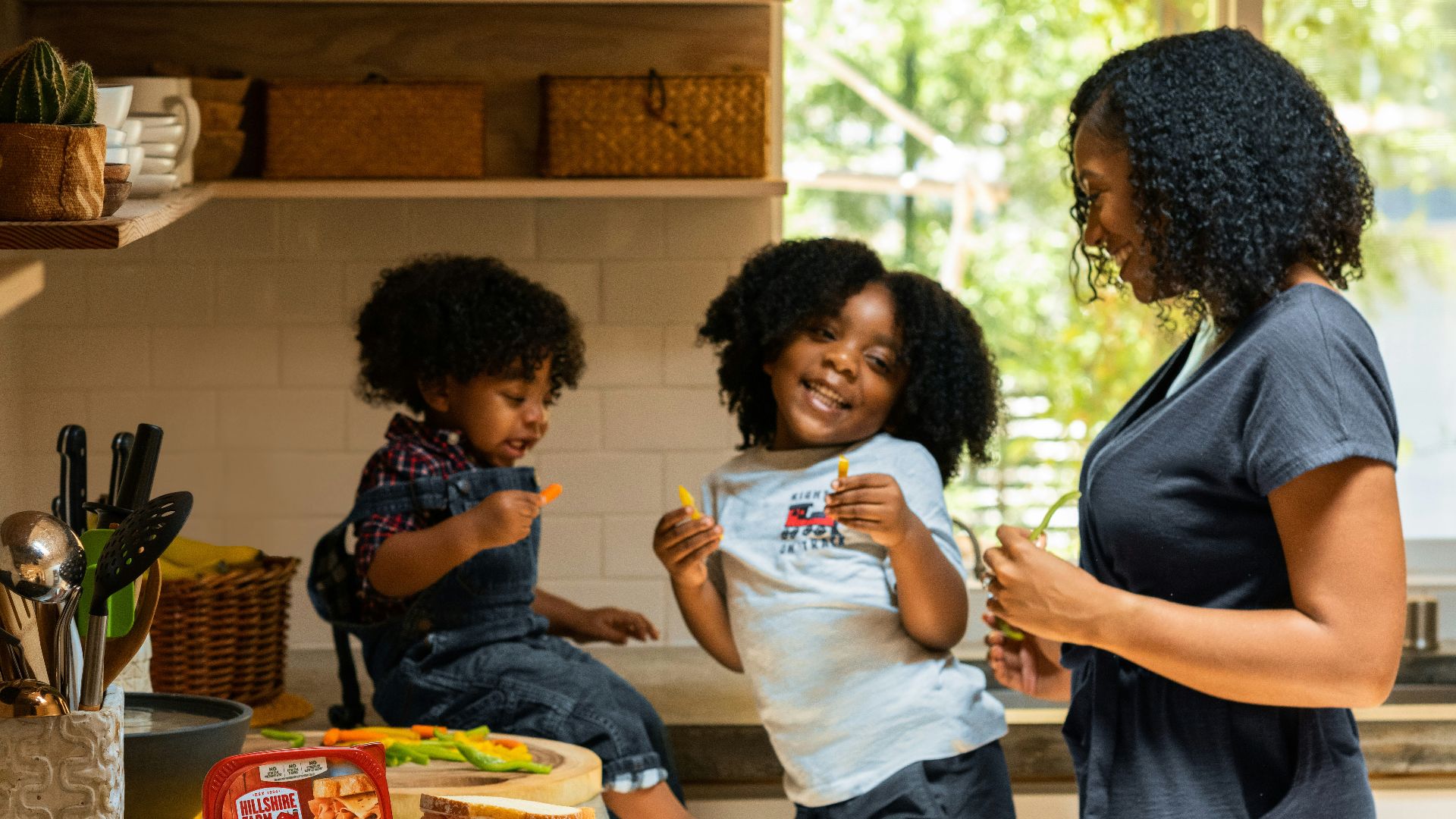 woman in white t-shirt standing beside woman in black and white stripe shirt