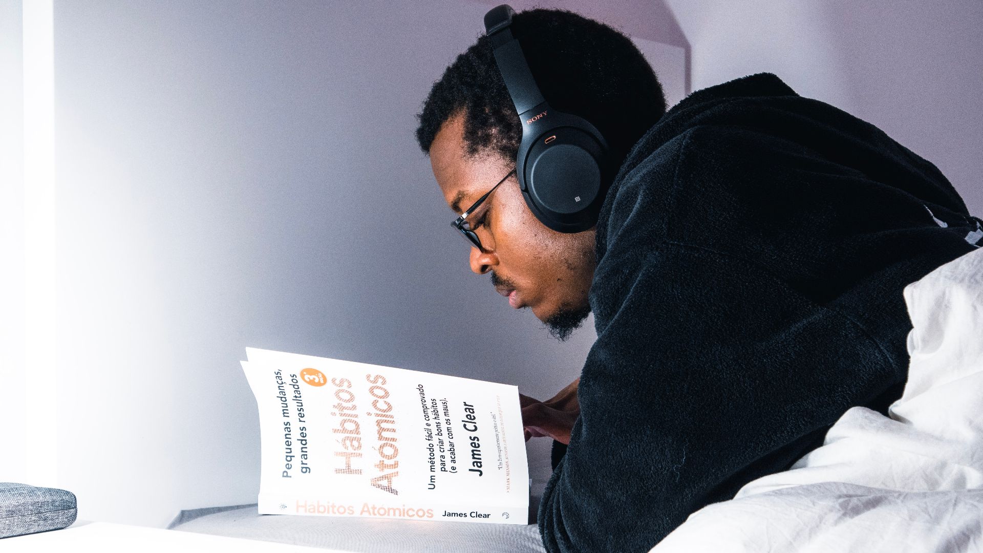man in black jacket wearing black headphones