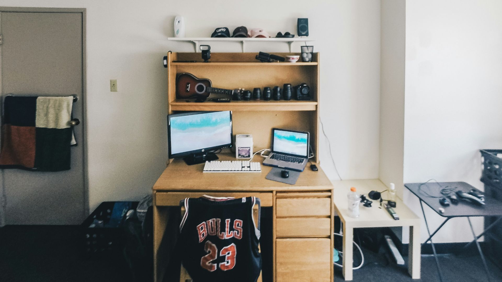 brown wooden desk with computer set
