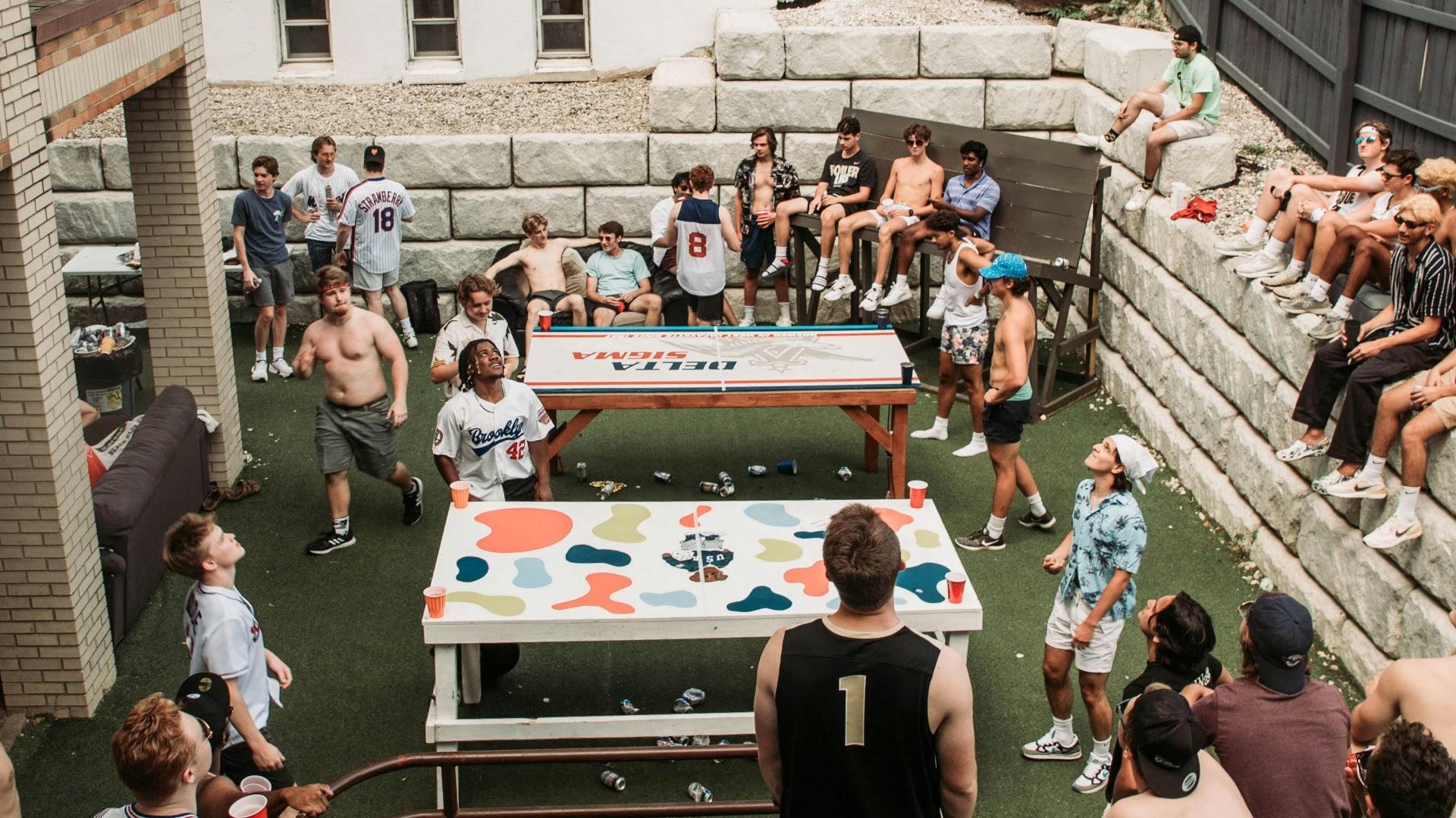 a group of people playing a game of ping pong