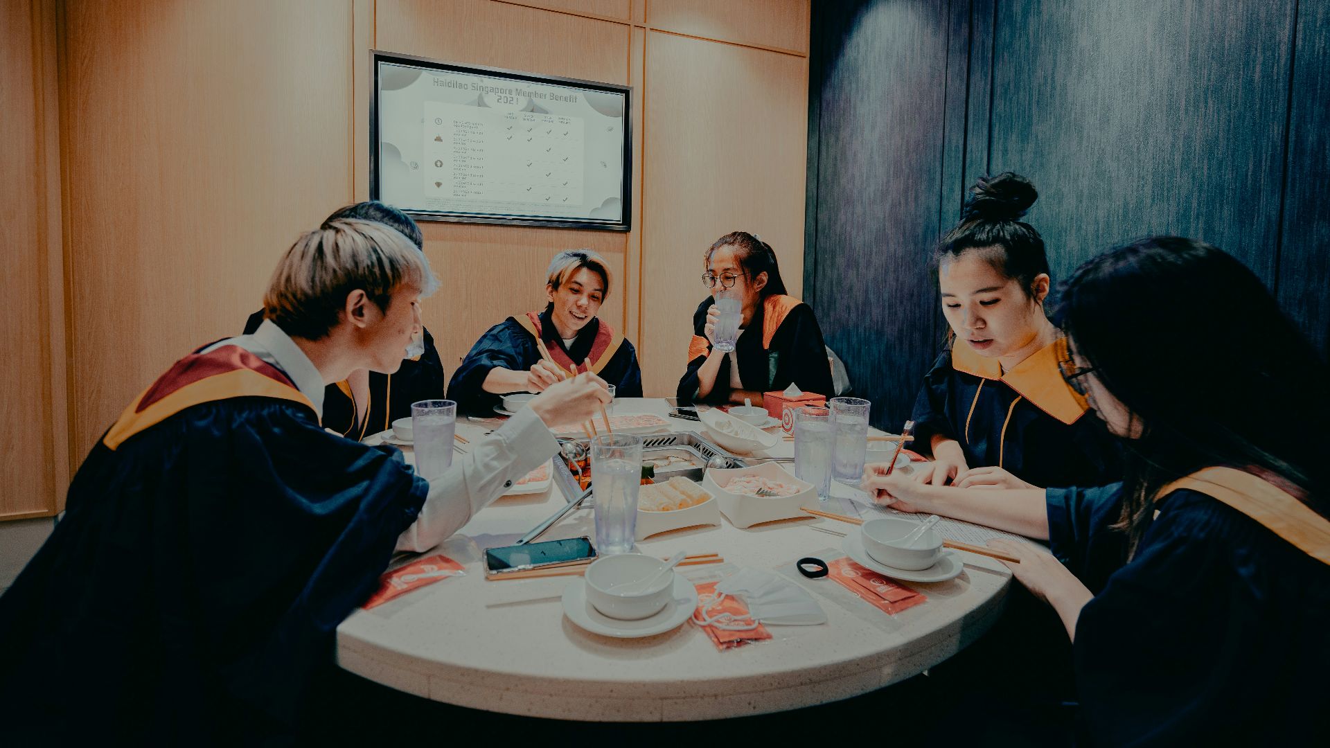 group of people sitting around table