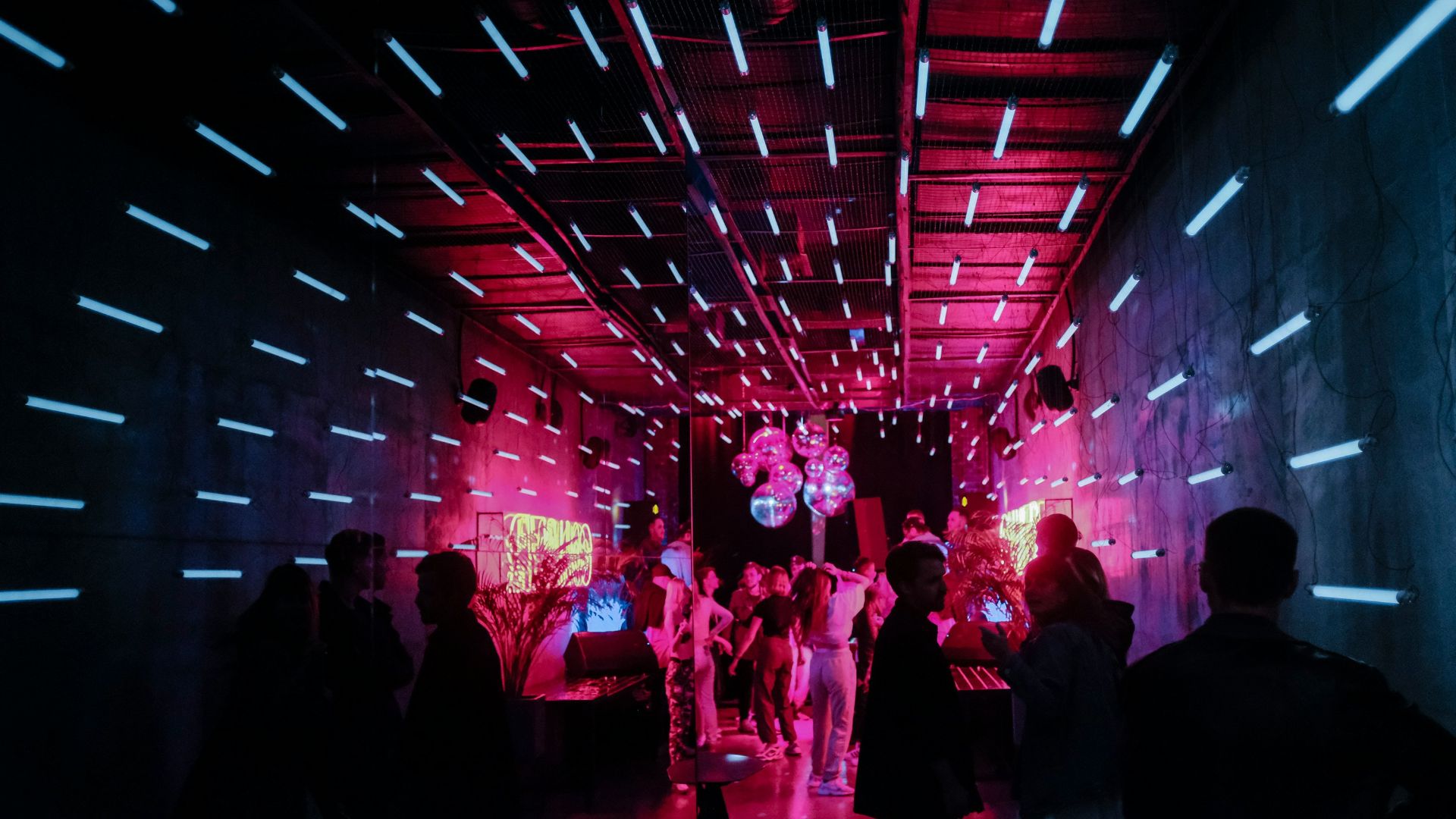 a group of people standing around in a room