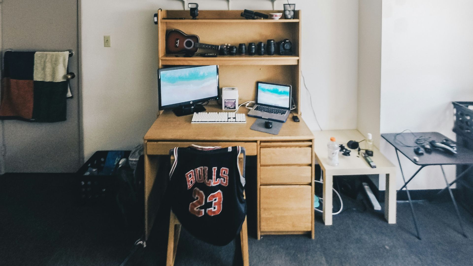 brown wooden desk with computer set