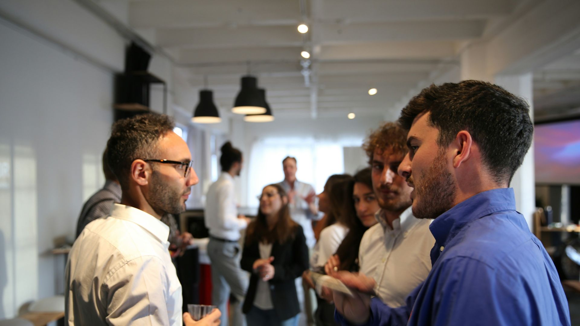 a group of people standing in a room
