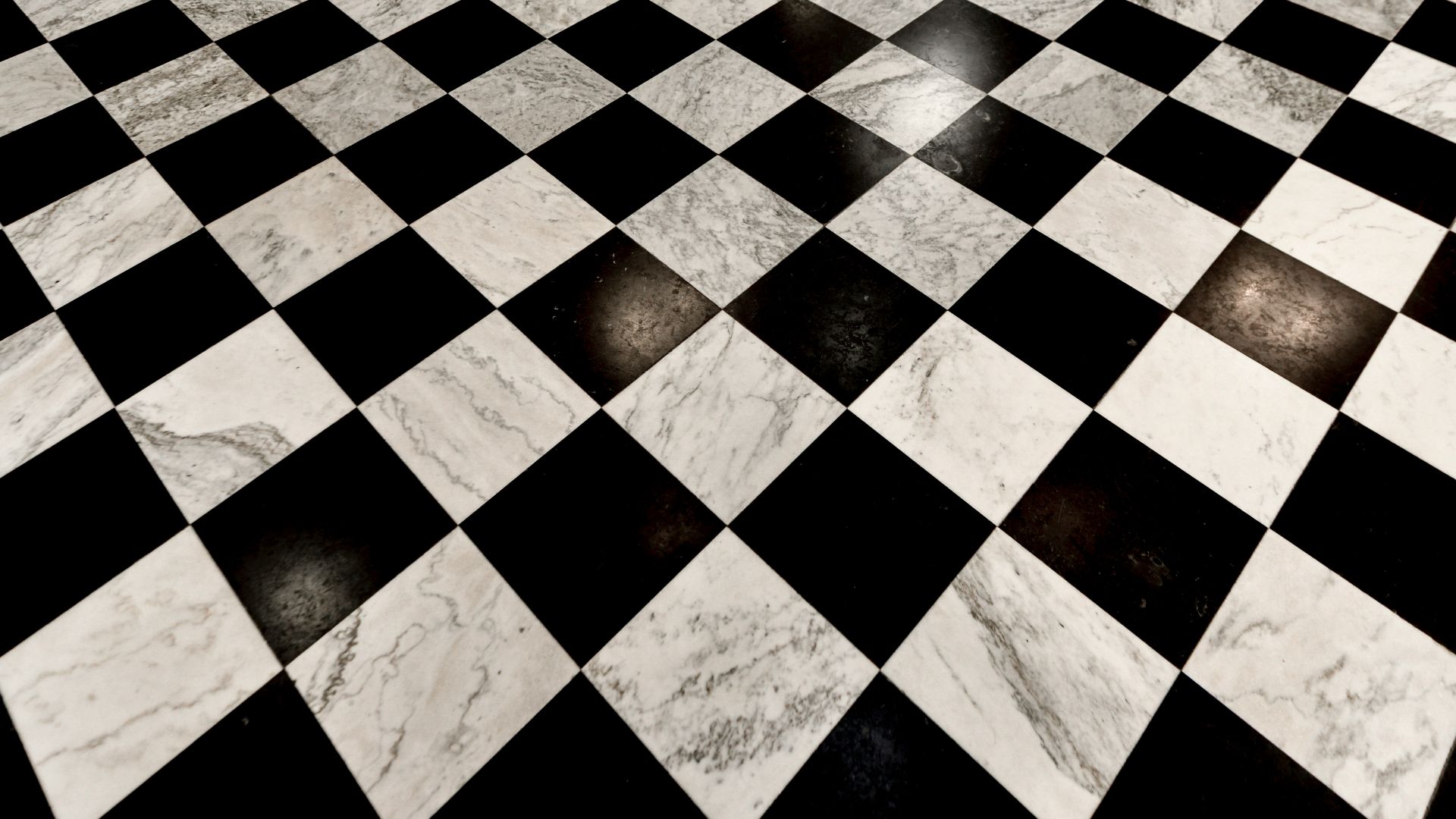 a black and white floor with a checkered pattern