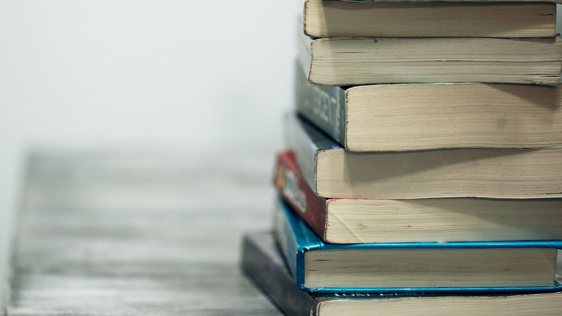 assorted books on wooden table