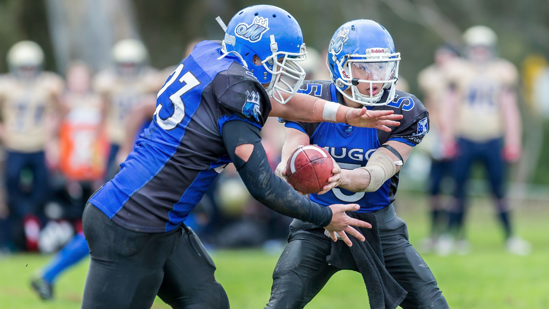 time-lapse photography of men playing football in field