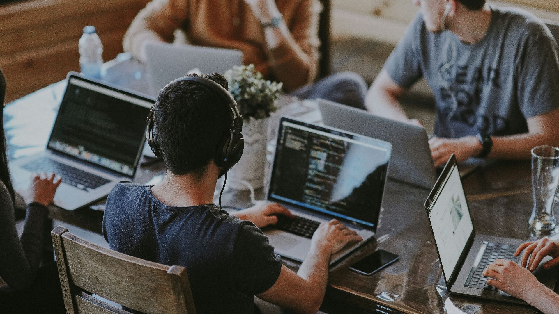 group of people using laptop computer