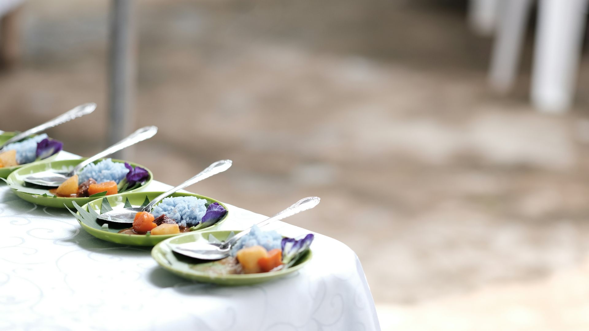 A row of plates of food on a table