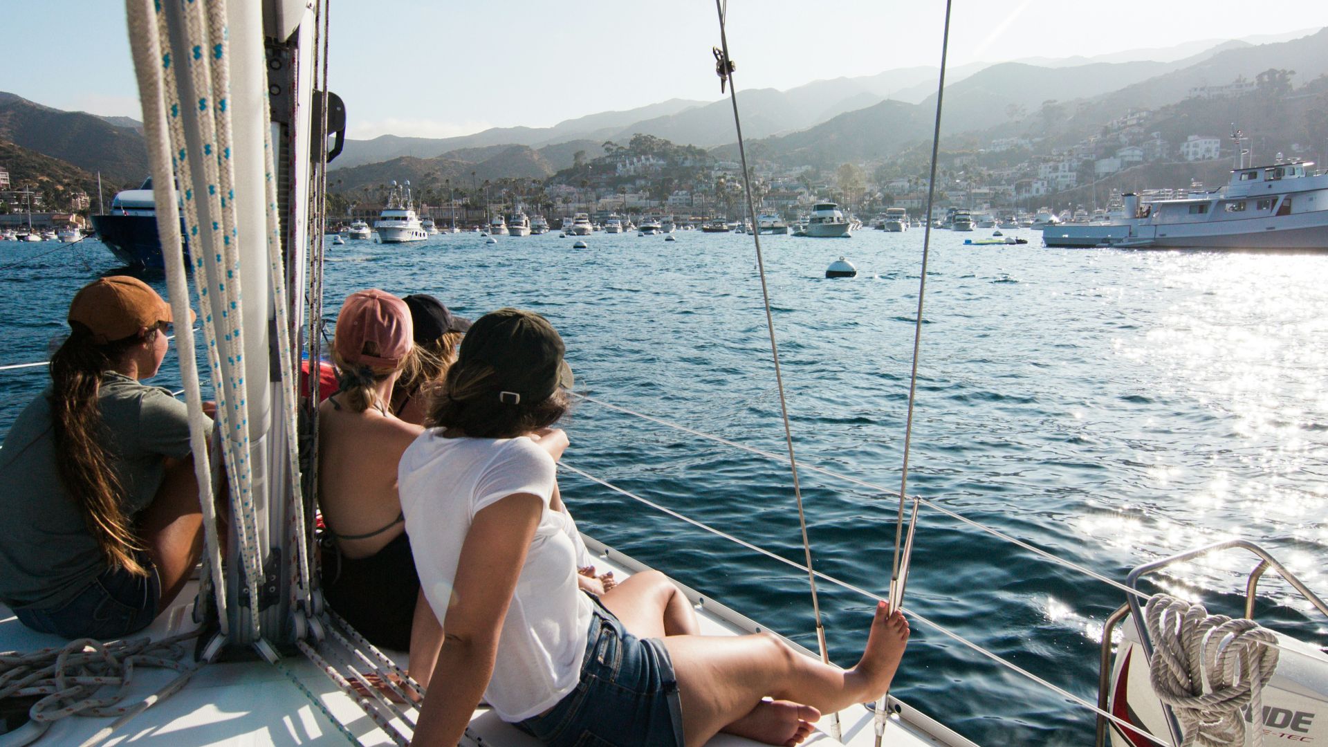 people sitting on front of yacht