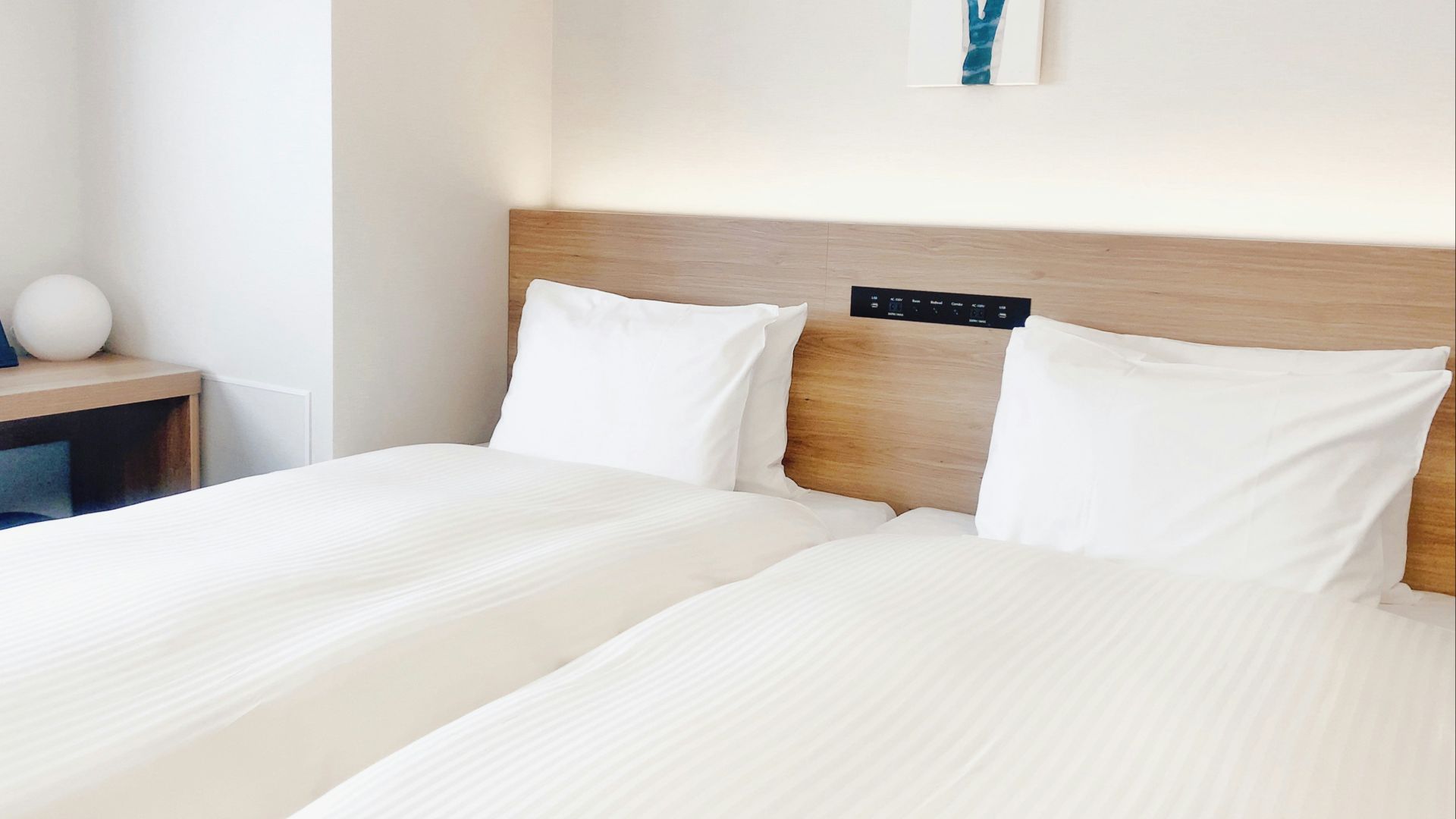 white bed pillow on bed