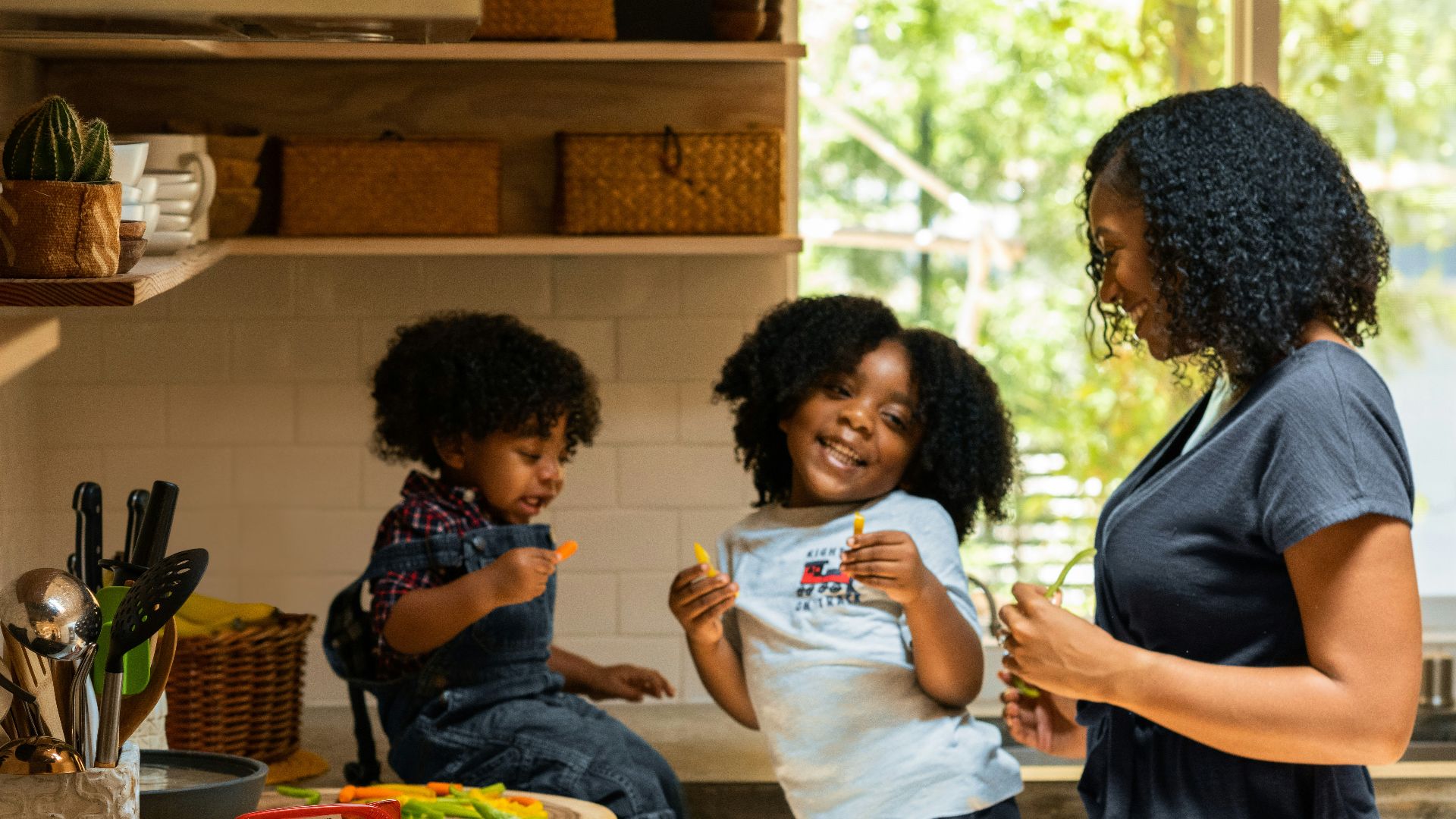woman in white t-shirt standing beside woman in black and white stripe shirt