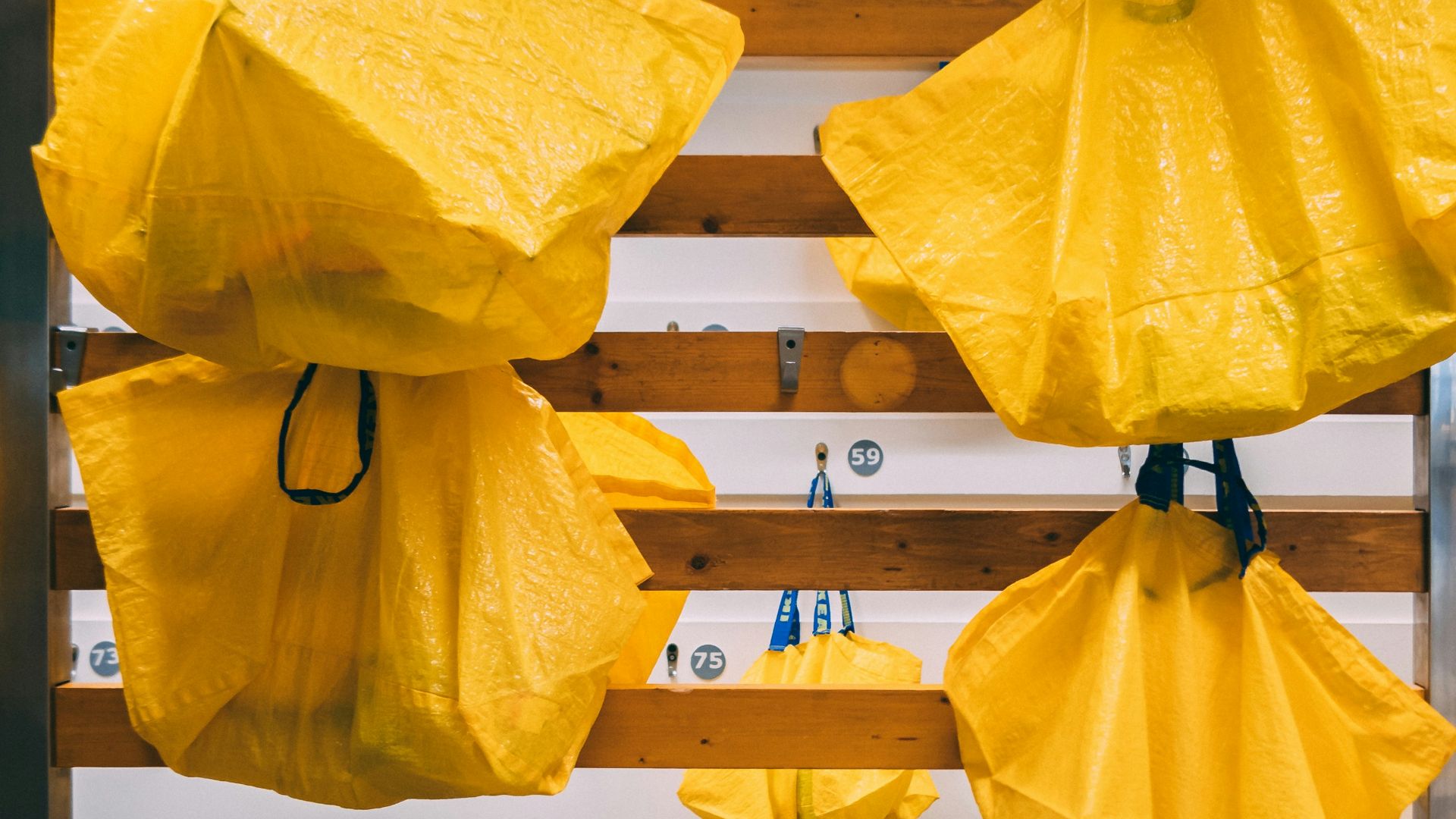 yellow paper lantern hanging on black metal bar