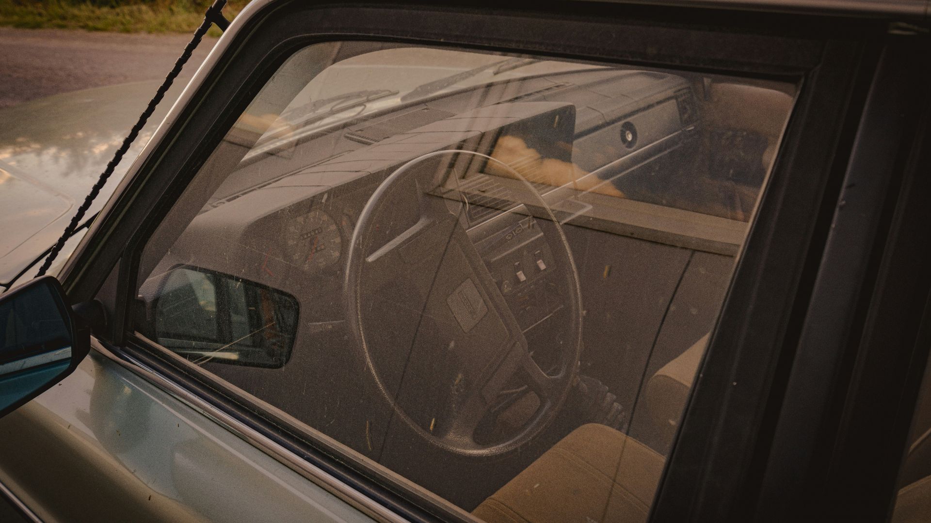 a car with a steering wheel on the dashboard
