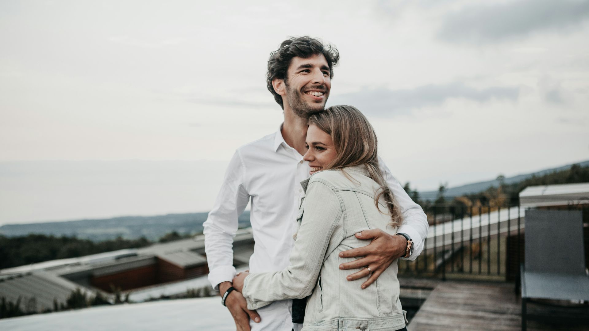 man and woman hugging each other