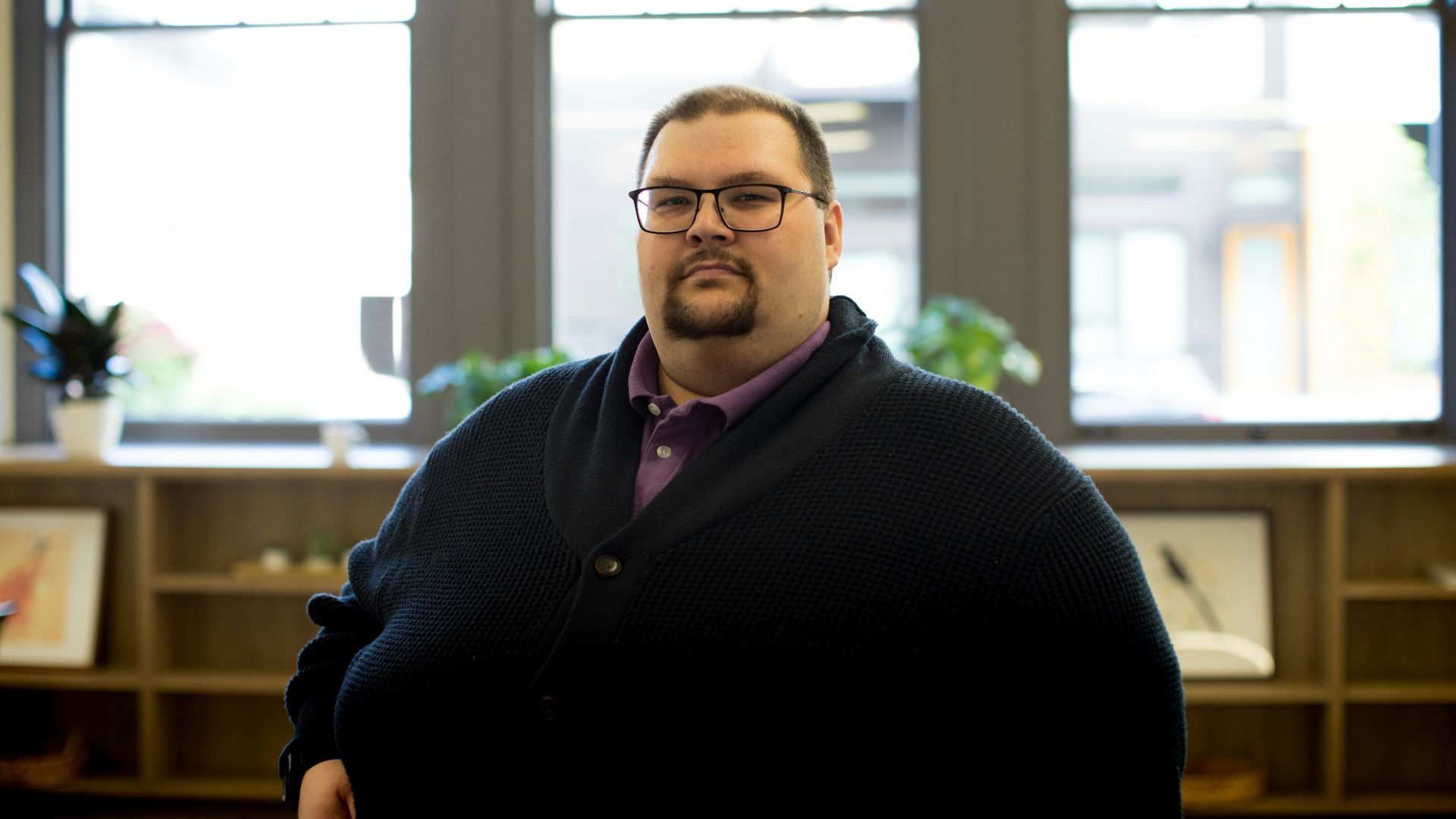 man in black cardigan