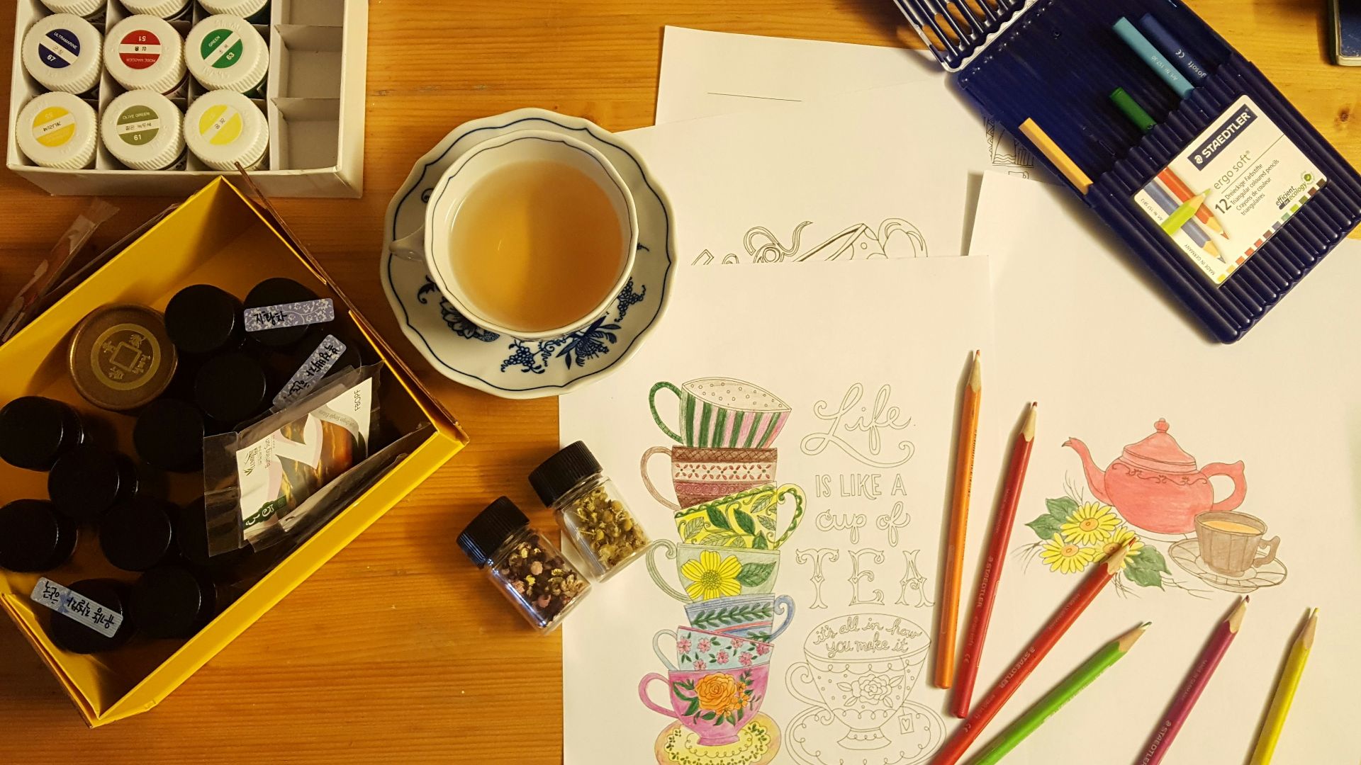 black and white ceramic mug on brown wooden table