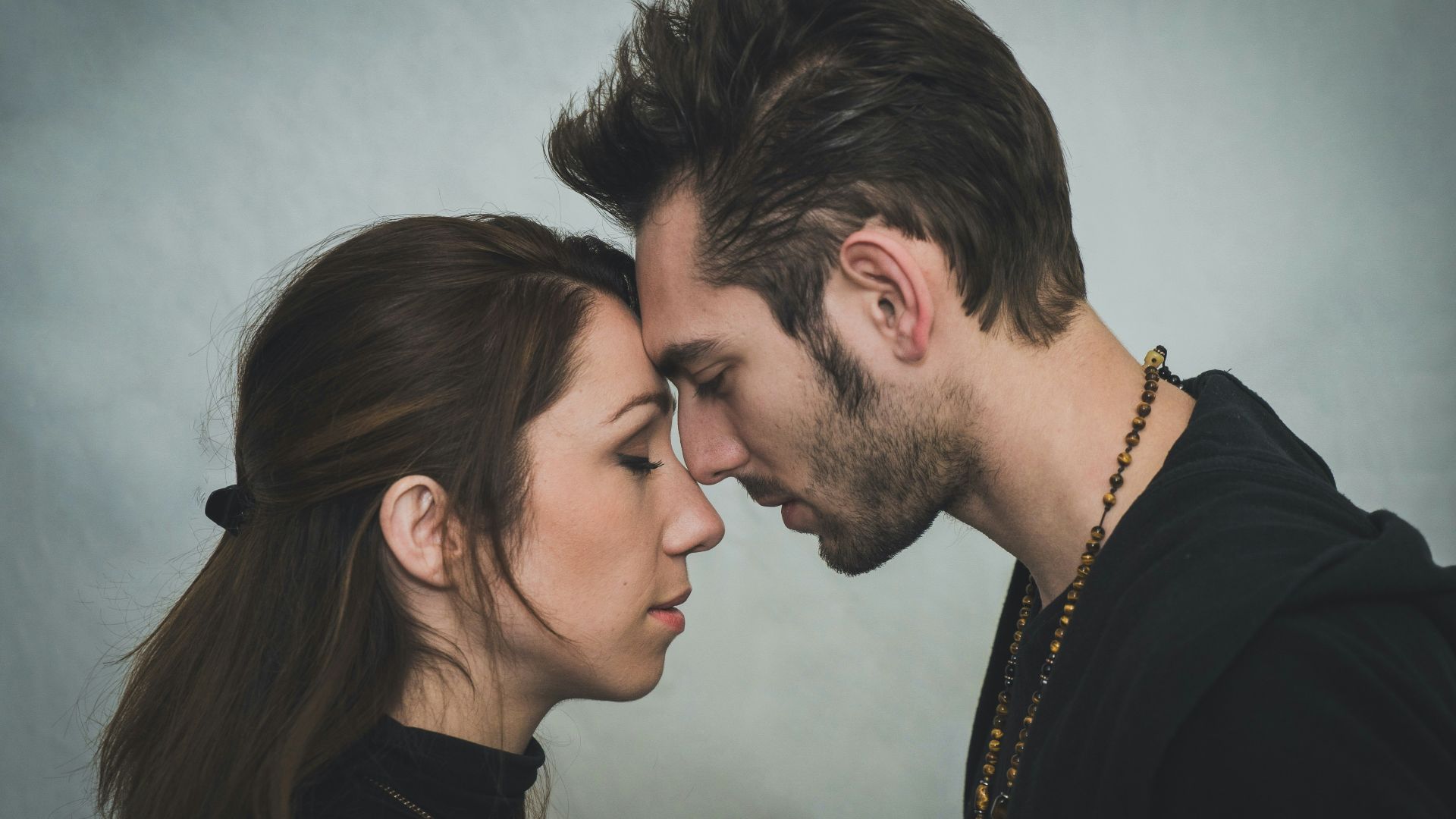 man and woman kissing each other