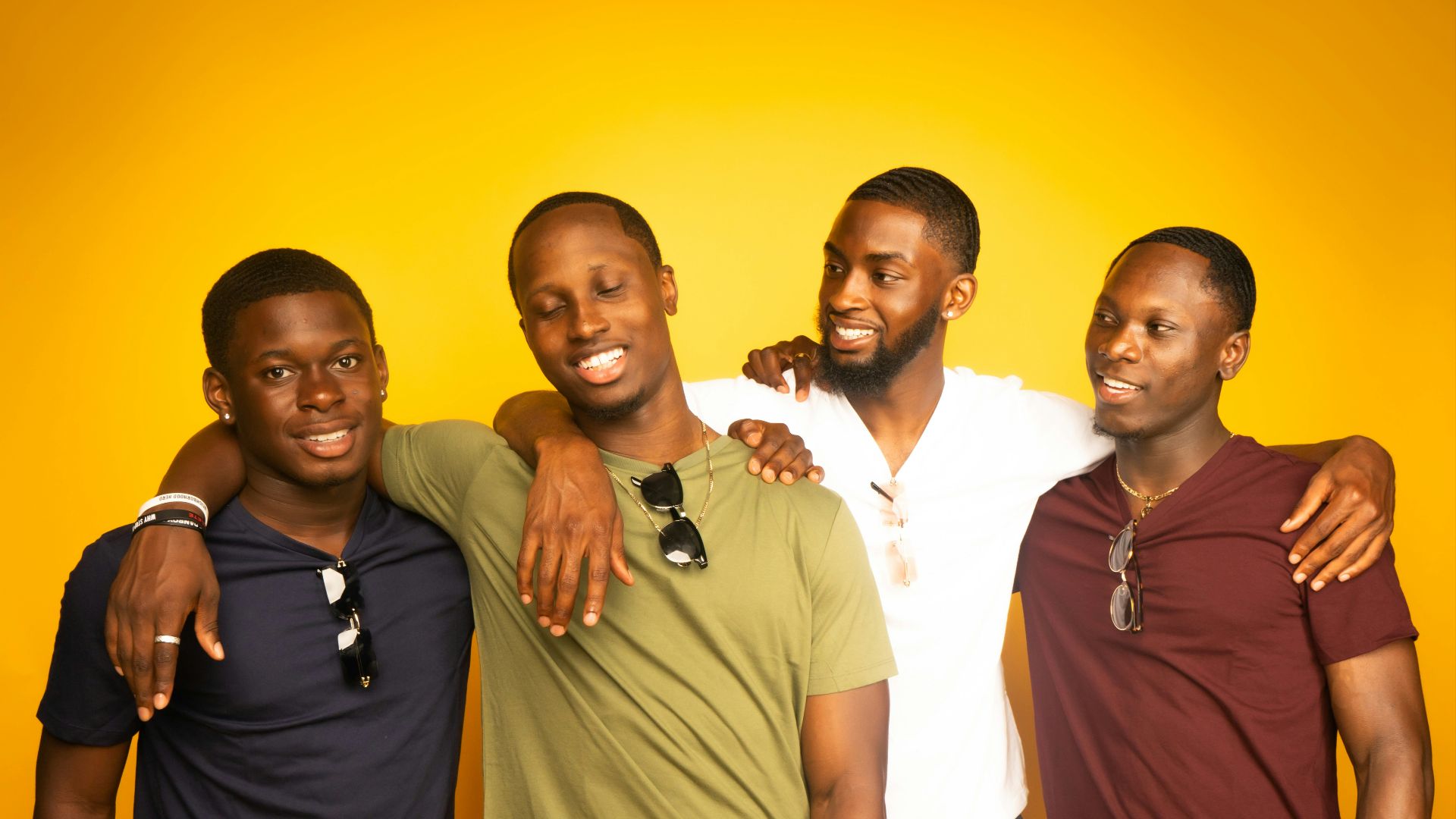 3 men and 2 women standing side by side