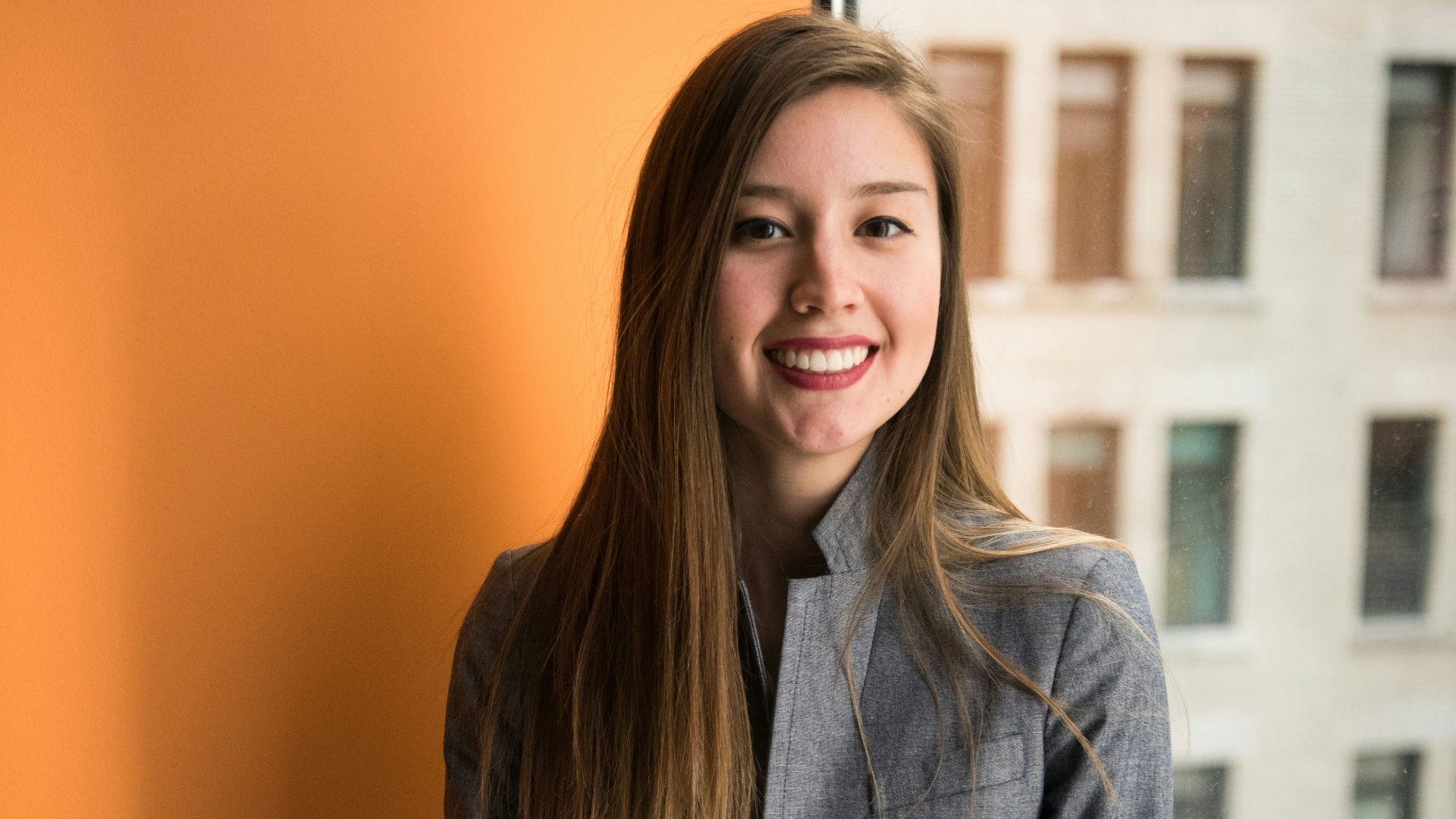 shallow focus photo of woman in gray jacket