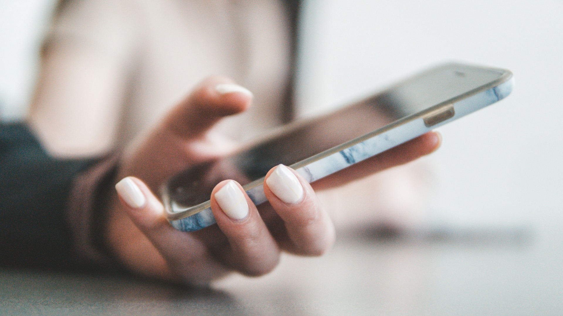 person holding black smartphone
