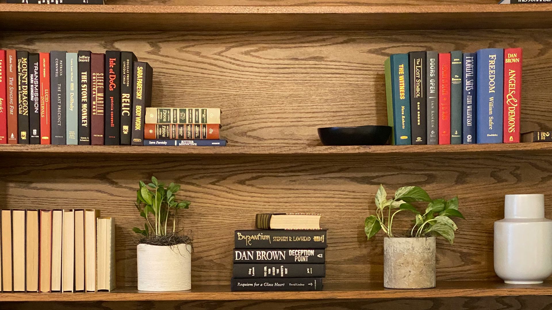 books on brown wooden shelf