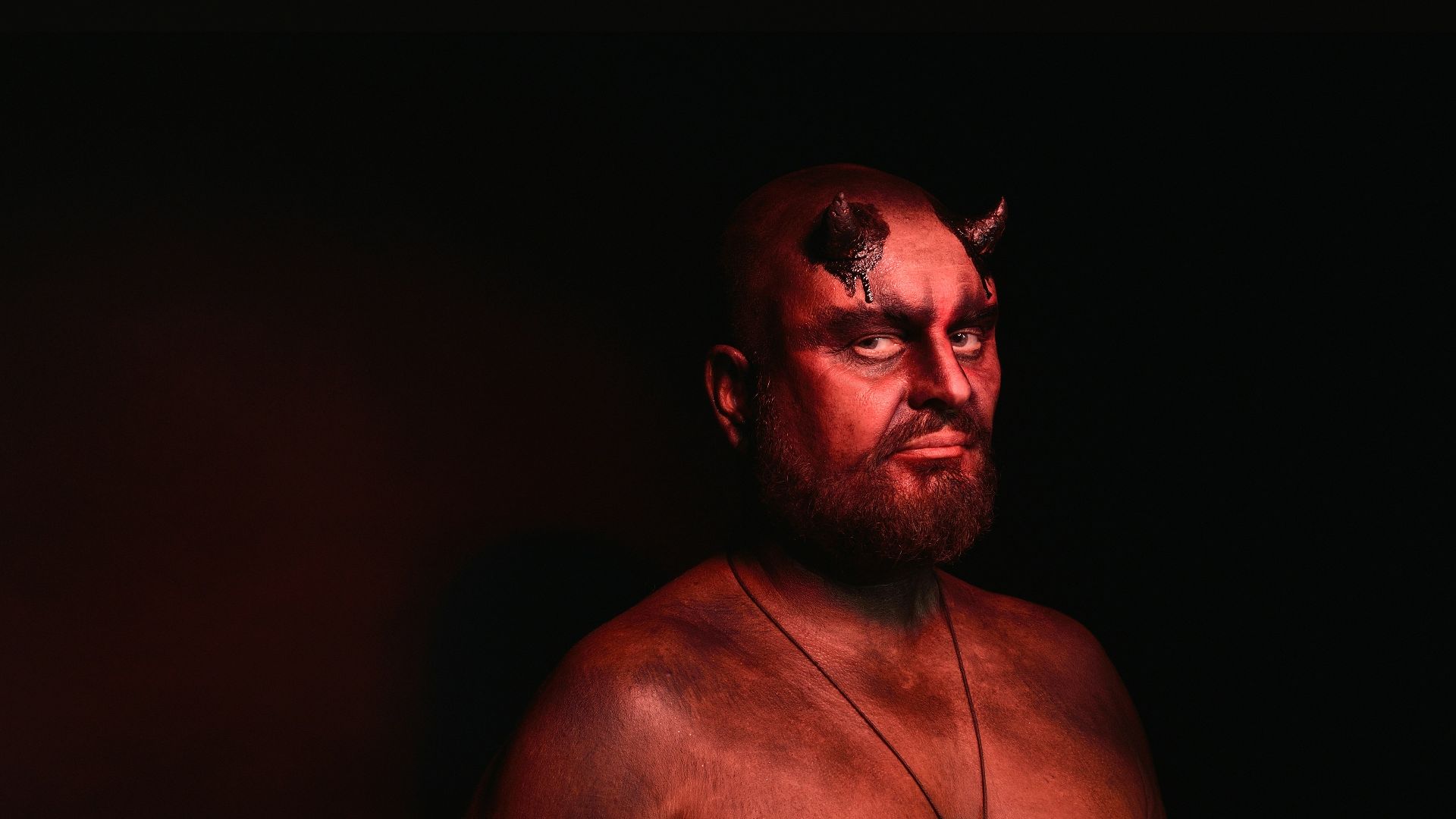 man wearing demon costume